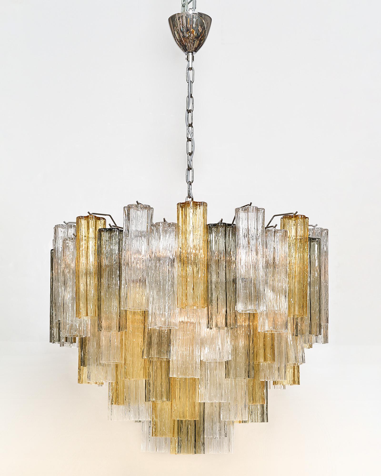 Murano glass chandelier from Italy with hand-blown glass elements in the “tronchi” shape. This fixture has amber, smoked, and clear glass and has been newly wired to fit US standards.