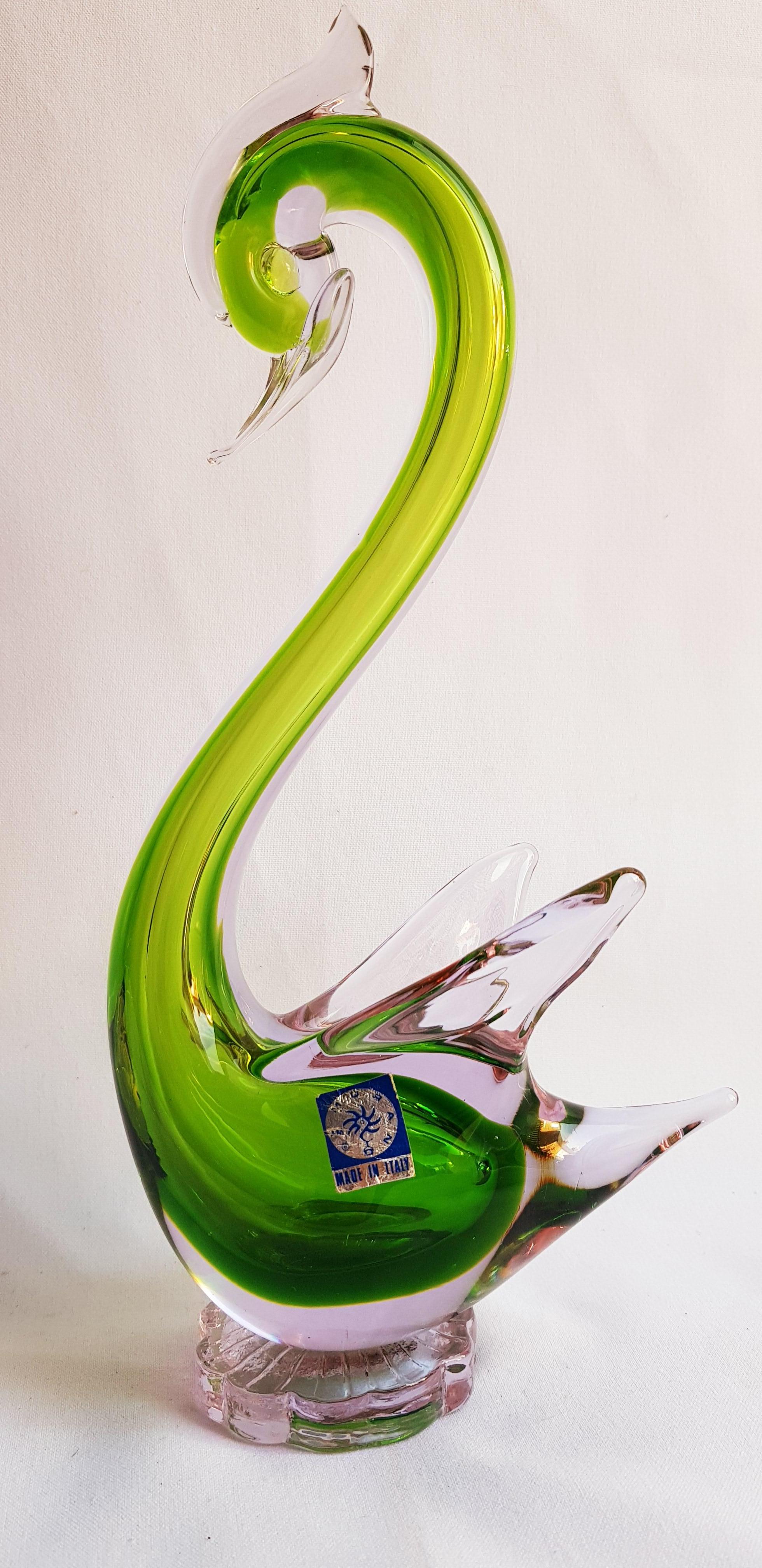 Beautiful Murano glass alexandrite neodymium colour-changing sommerso swan in purple and green, attributed to Galliano Ferro; years 1960-1969. The colour of the sculpture changes to green by fluorescent light and to pink by black light. In excellent