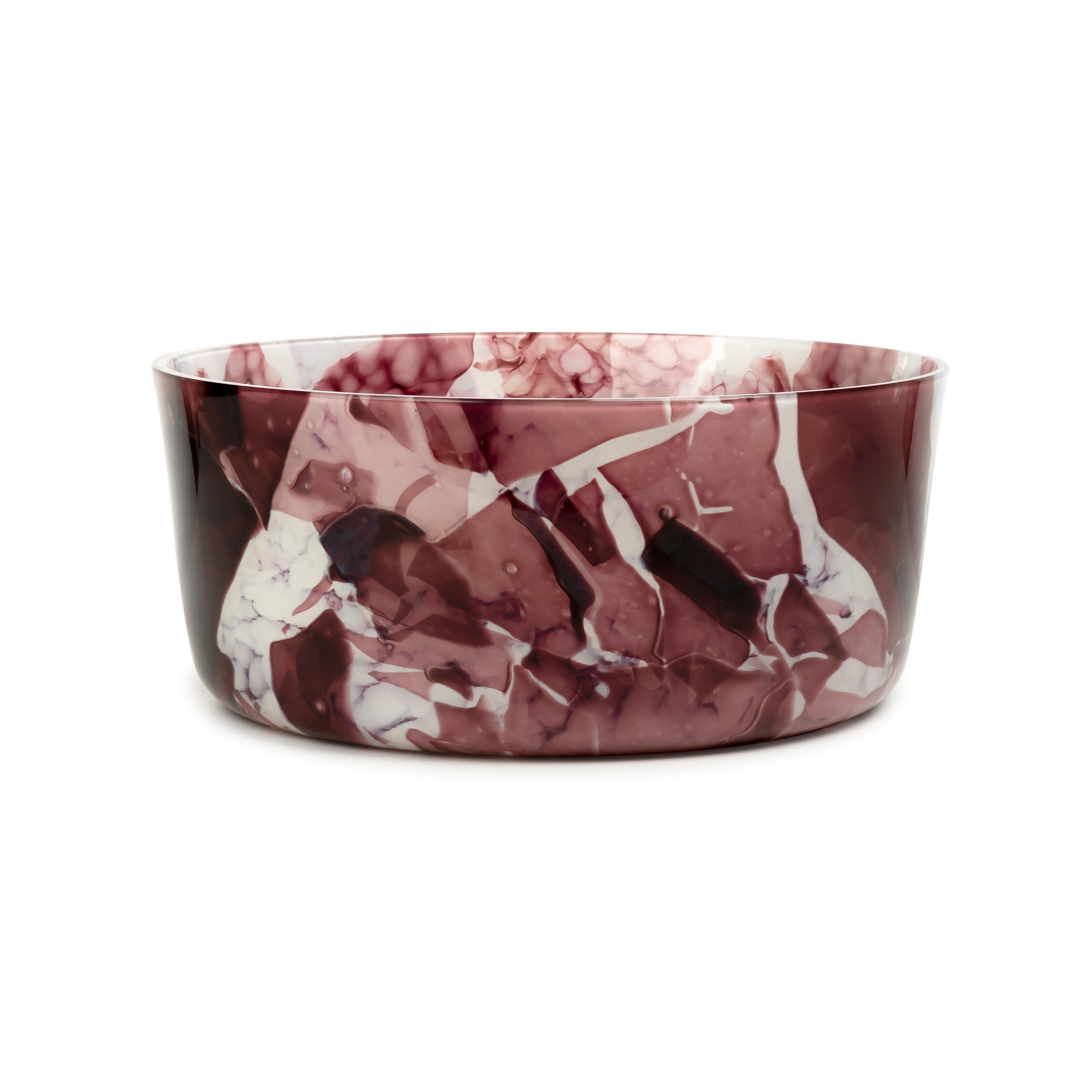 Our glass bowl is meticulously crafted by skilled artisans in Venice. Its stunning amethyst color effortlessly enchants the eyes, bringing a touch of sophistication to any space. Each bowl is meticulously formed using the ancient Murano glassblowing