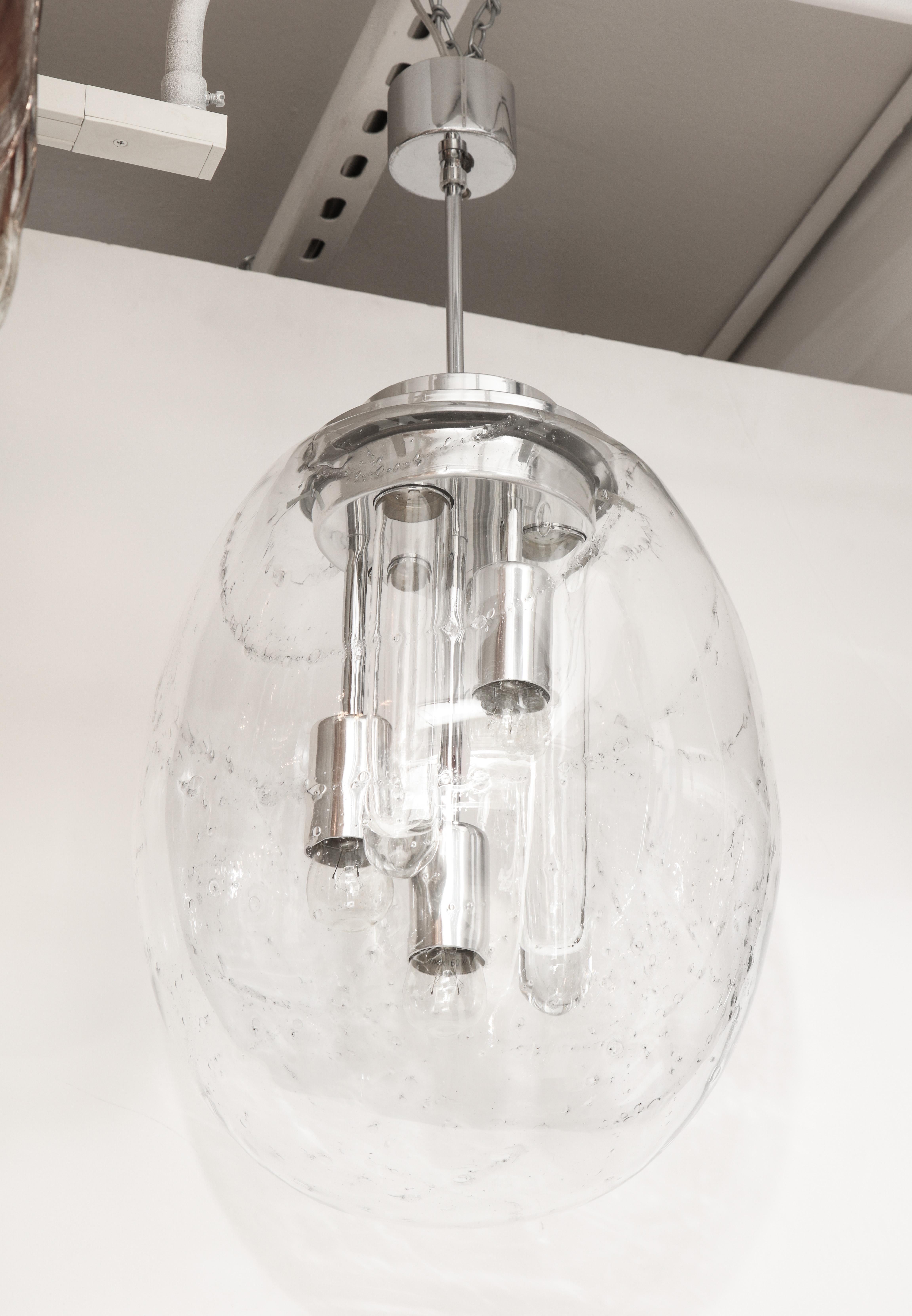 Midcentury hand blown glass shade with slight grey veining inclusion with 3 glass reflecting tubes and 3 light sources suspended from a nickel stem or canopy. Rewired for use in the USA.