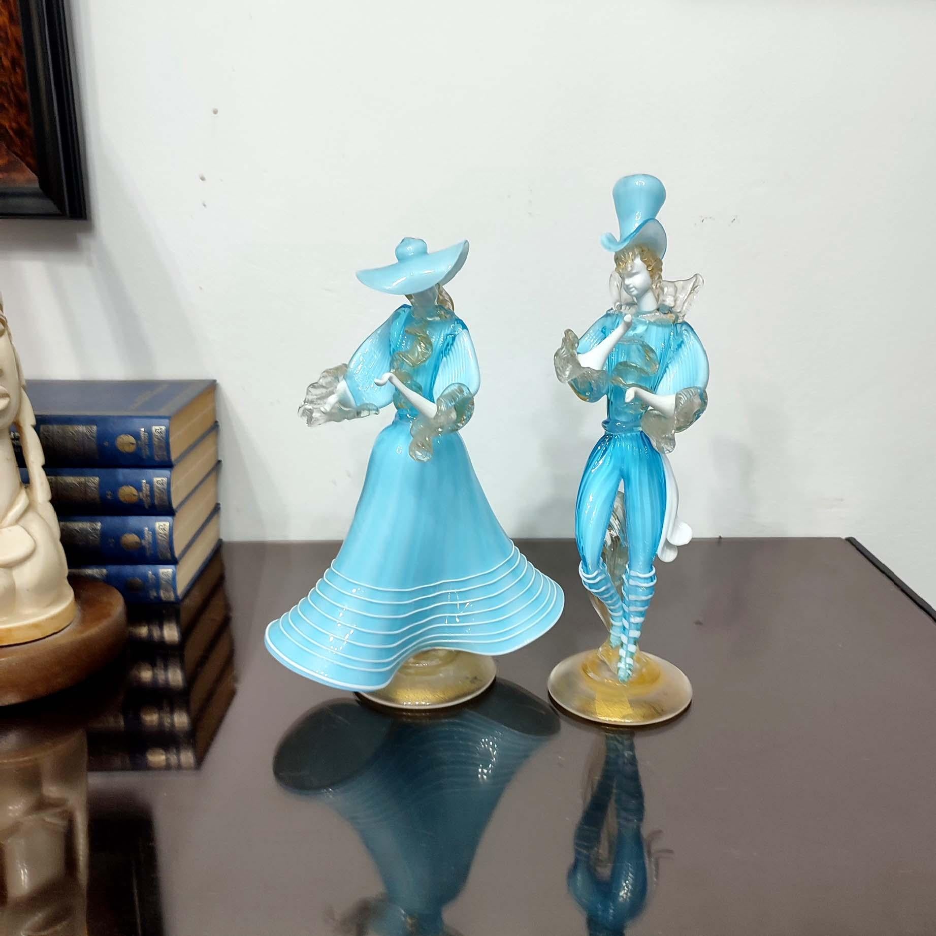 Beautiful vintage glass sculptures of a Venetian couple, entirely handmade using several traditional Venetian glass techniques.
An exquisite couple in a dancing posture, perfectly proportioned. The light blue tone, detailed faces, and the dance
