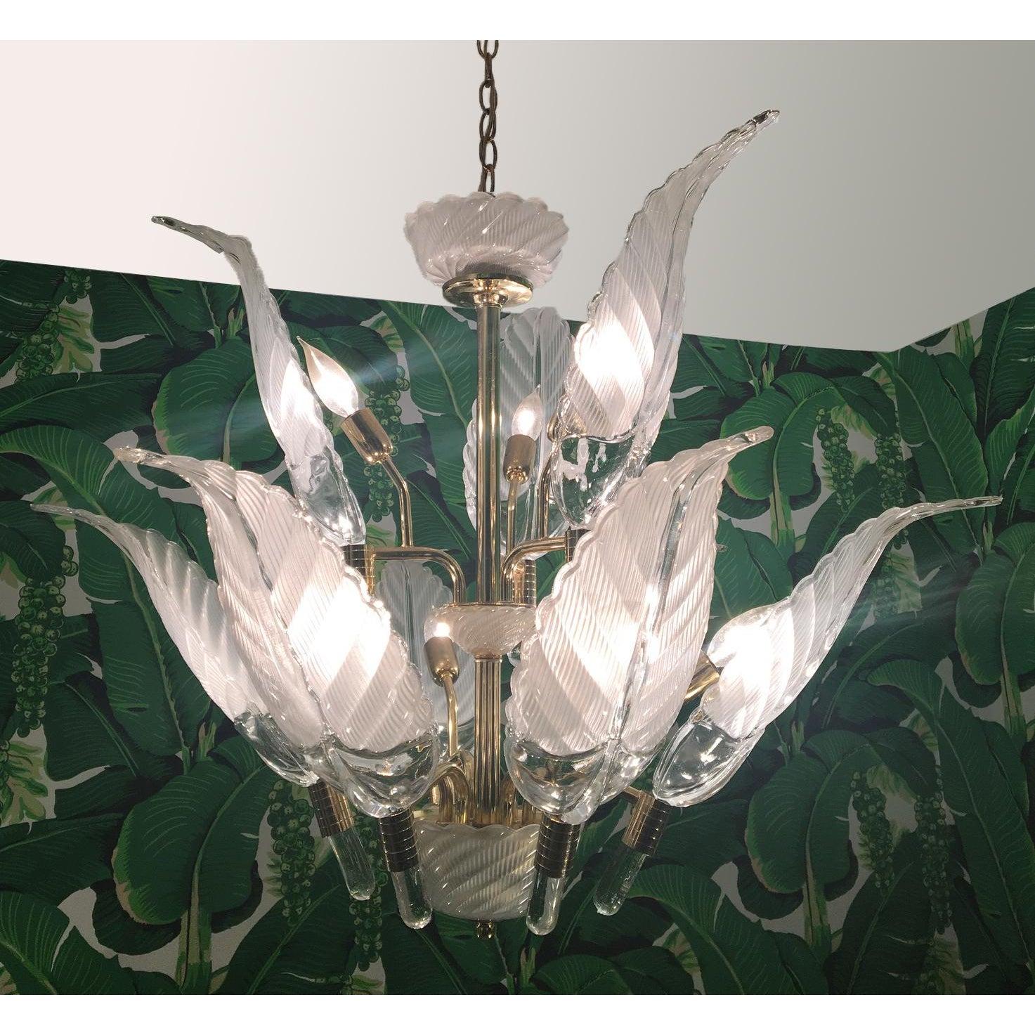Sculptural glass palm leaf chandelier by Murano features brass frame and nine-light. Clear glass frawns measure: 18