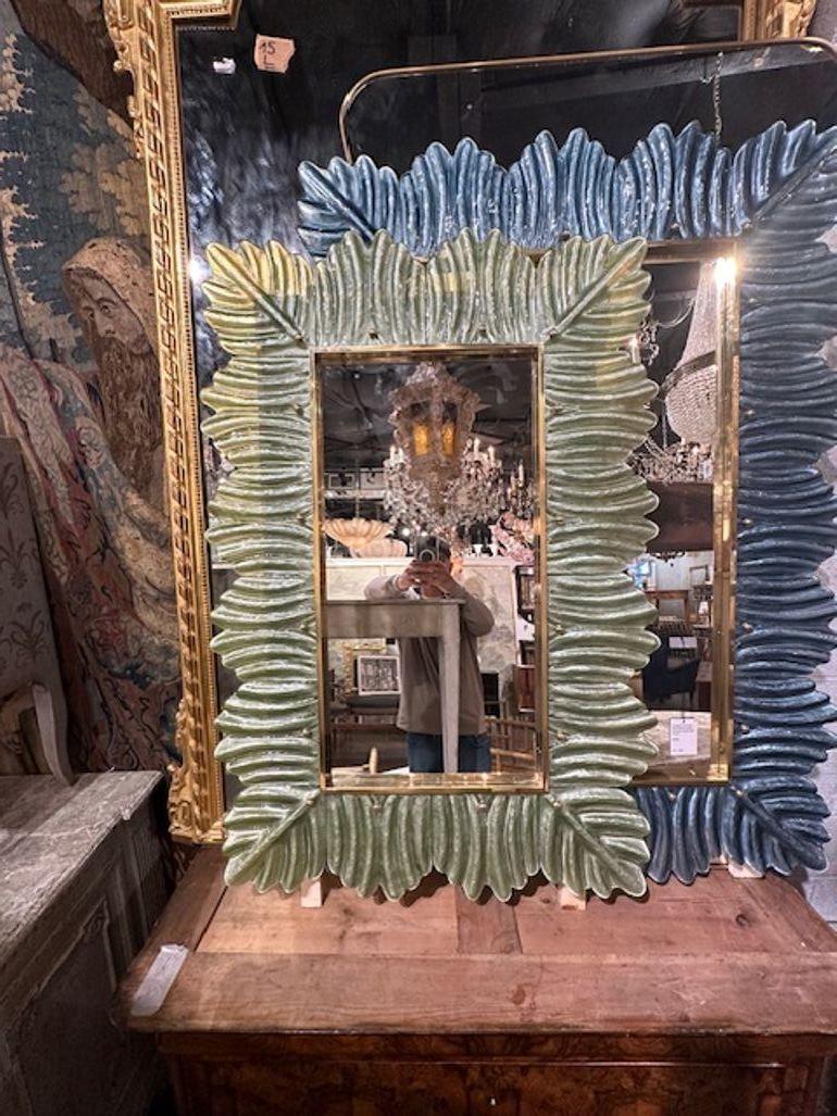 Modern Murano glass and brass palm leaf mirror in pale green. Perfect for today's transitional designs!
