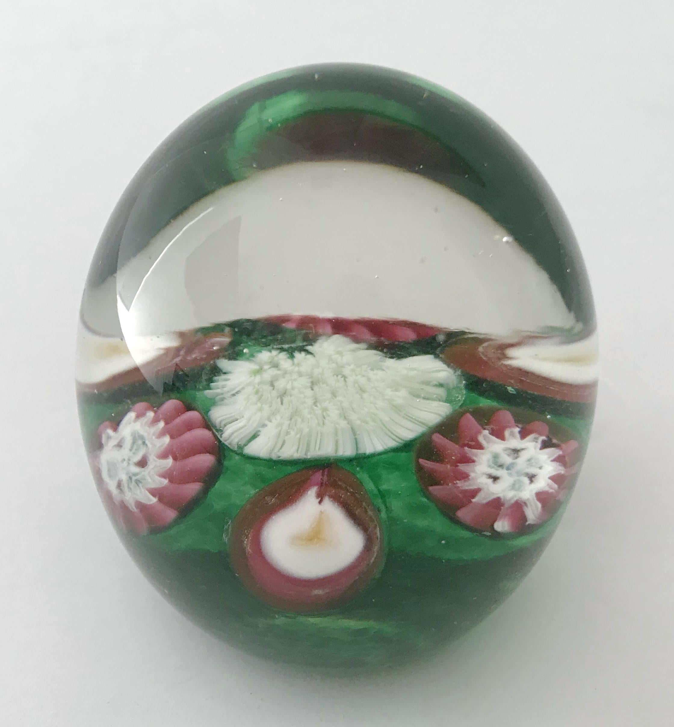 Vintage Italian Murano glass paperweight hand blown with multicolored glass canes to form 