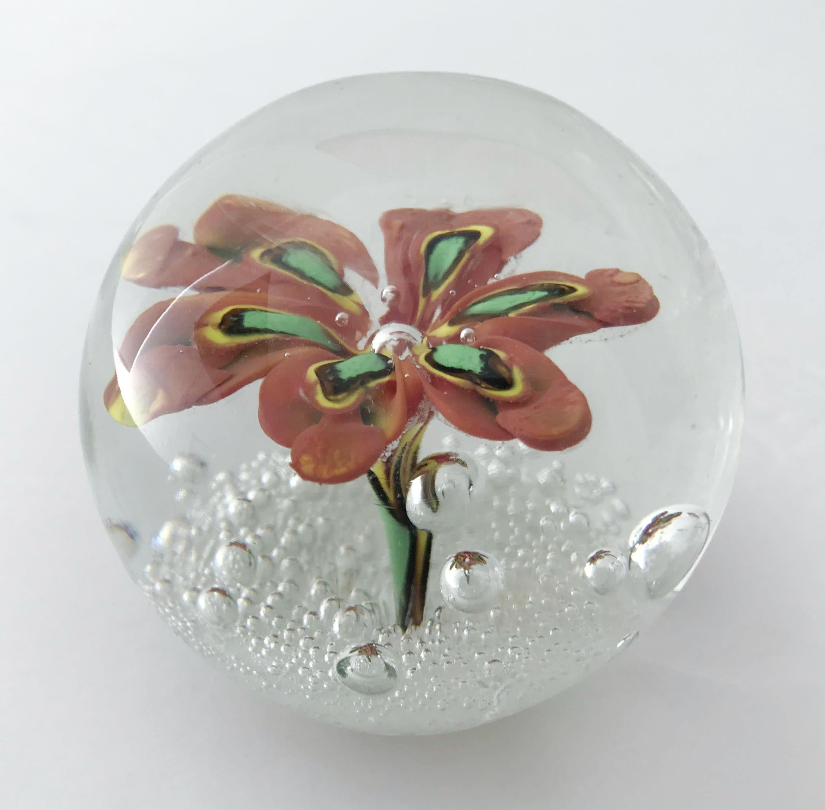 Vintage Italian Murano glass paperweight with a large hand blown flower in red, yellow and green and small bubbles / Made in Italy, circa 1960s
Original sticker at the base
Measures: diameter 2.5 inches / height 2.25 inches
1 in stock in Palm