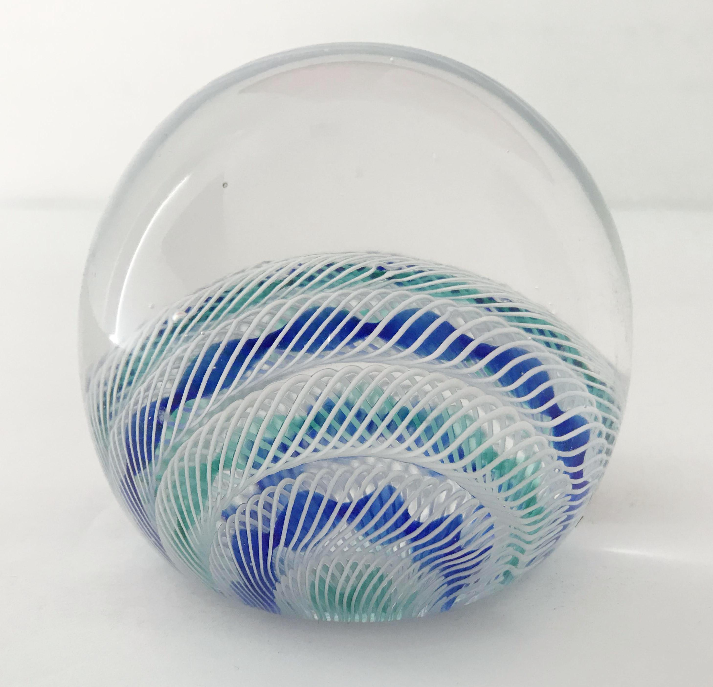Vintage Italian Murano glass paperweight hand blown with intricate white, light blue, and dark blue ribbons / Made in Italy, circa 1960s
Original sticker on the base
Measures: diameter 3 inches, height 2.75 inches
1 in stock in Palm Springs ON 50%
