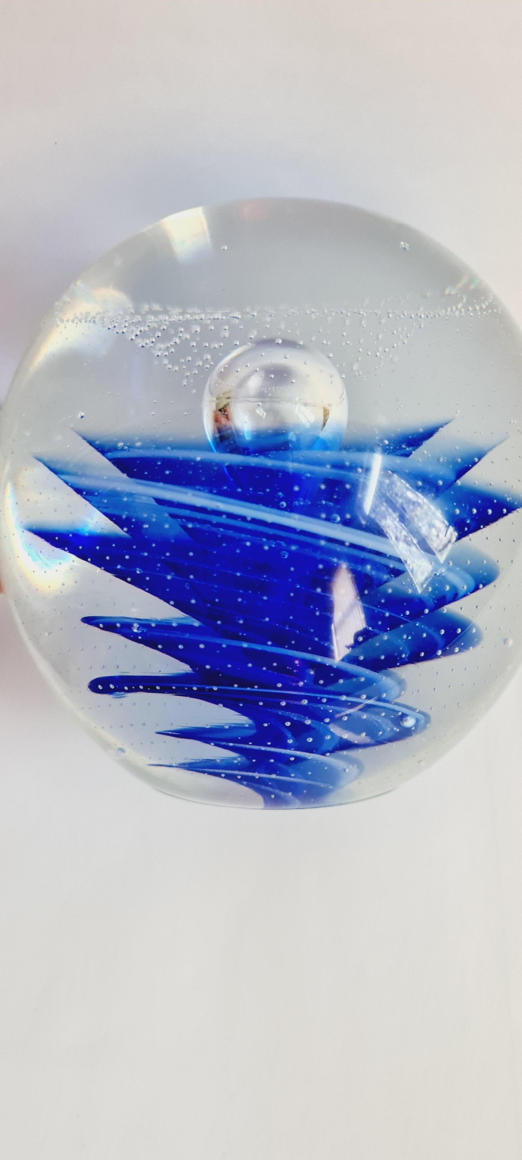 A large swirled Murano glass paperweight in blue and white with controlled bubbles, attributed to Galliano Ferro for Vetri Cenedese. In excellent condition.