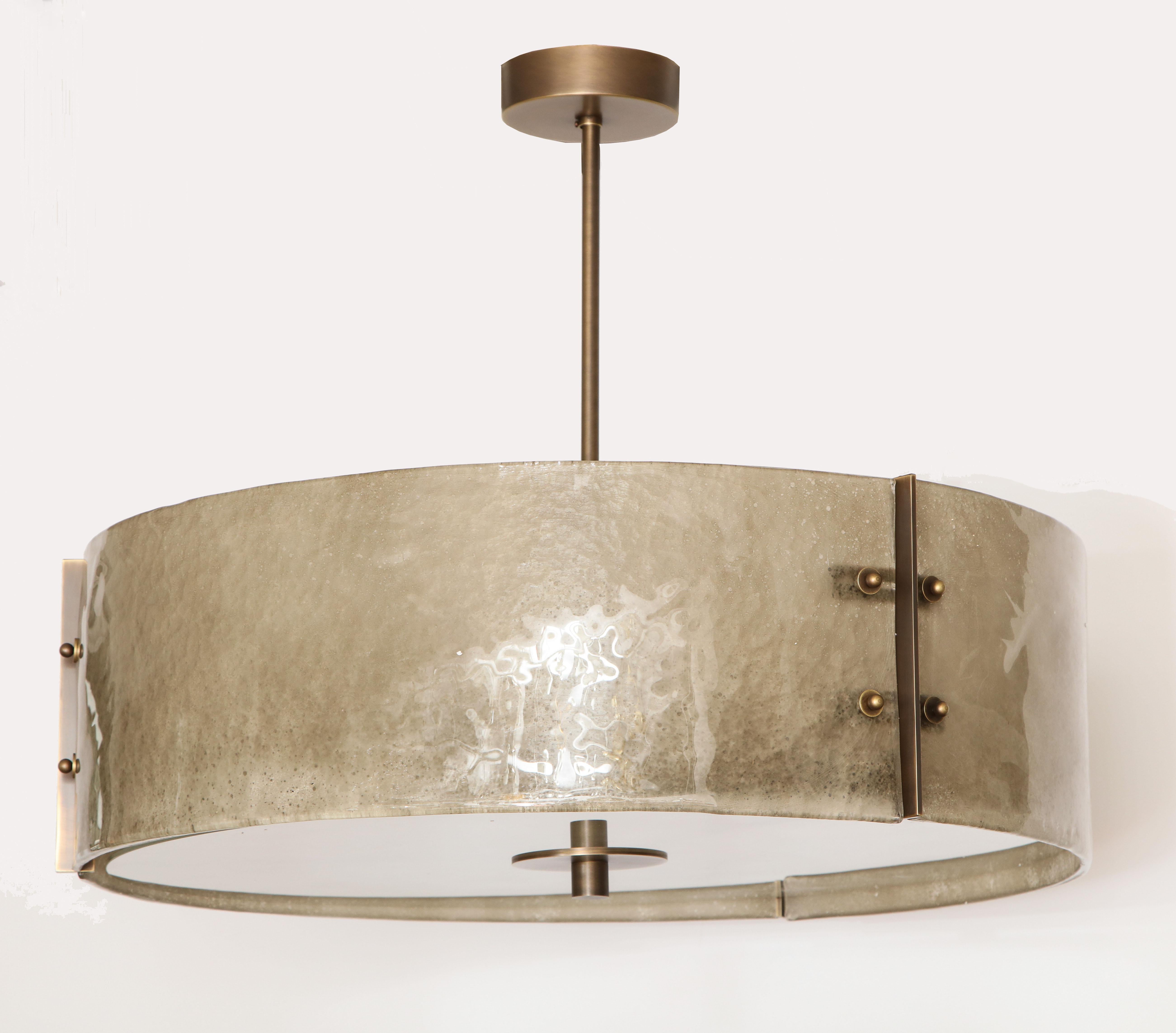 Murano scavo glass drum chandelier with patinated brass structure.
Priced per item, 2 available.
  