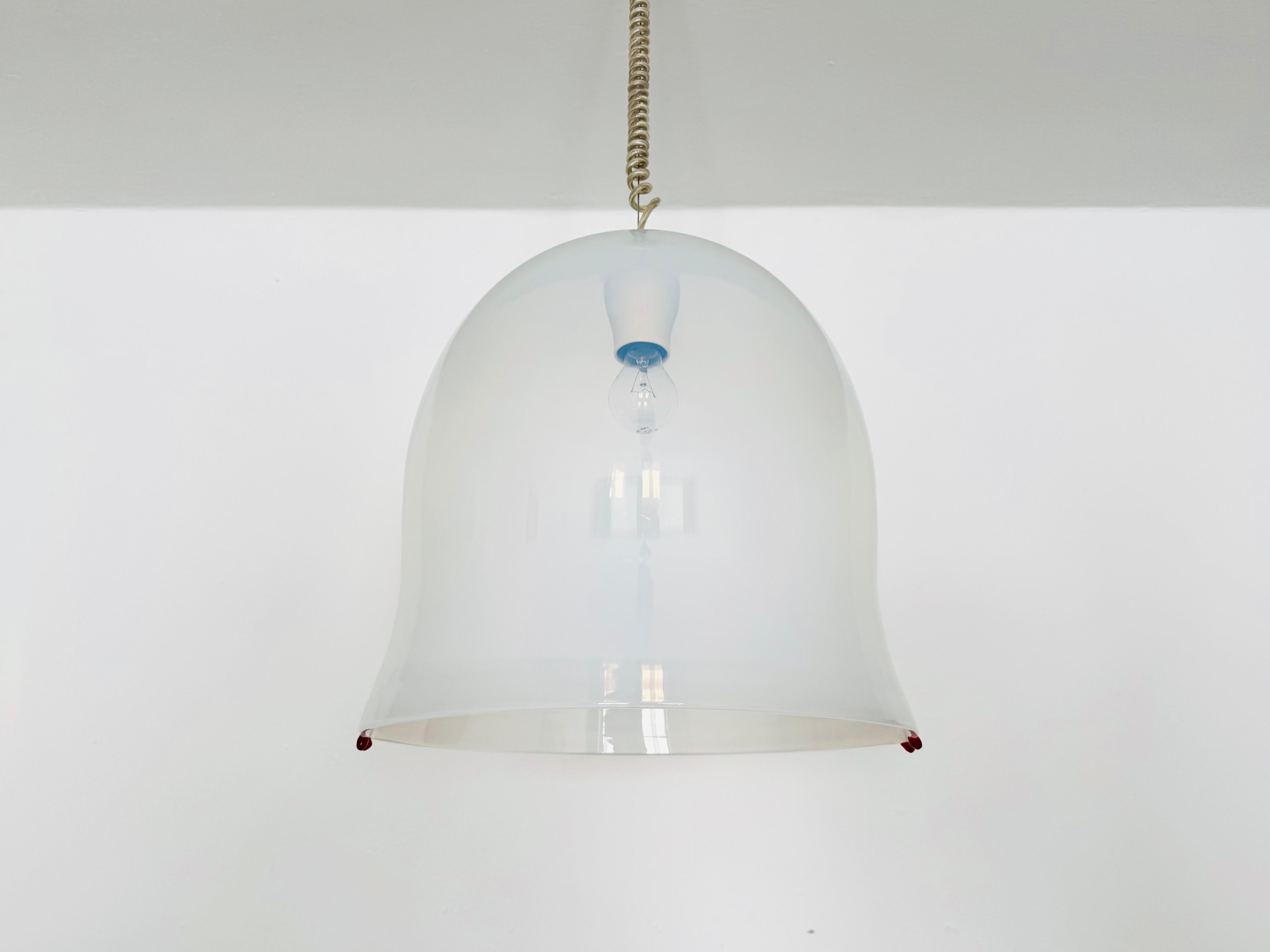 Impressive beautiful Murano glass lamp from the 1960s.
Exceptionally successful design and very high quality processed.
The special glass and the decorative red details create a spectacular light.

Design: Roberto Pamio and Renato Toso
Manufacturer: