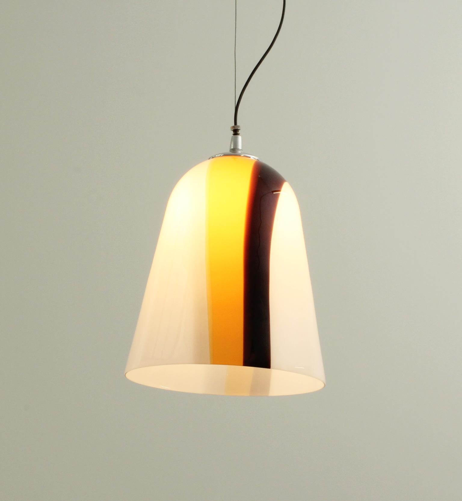 Murano glass pendant lamp from 1970's. White opaline glass with brown and yellow decoration with a chromed metal ball joint that allows the lamp to be tilted.