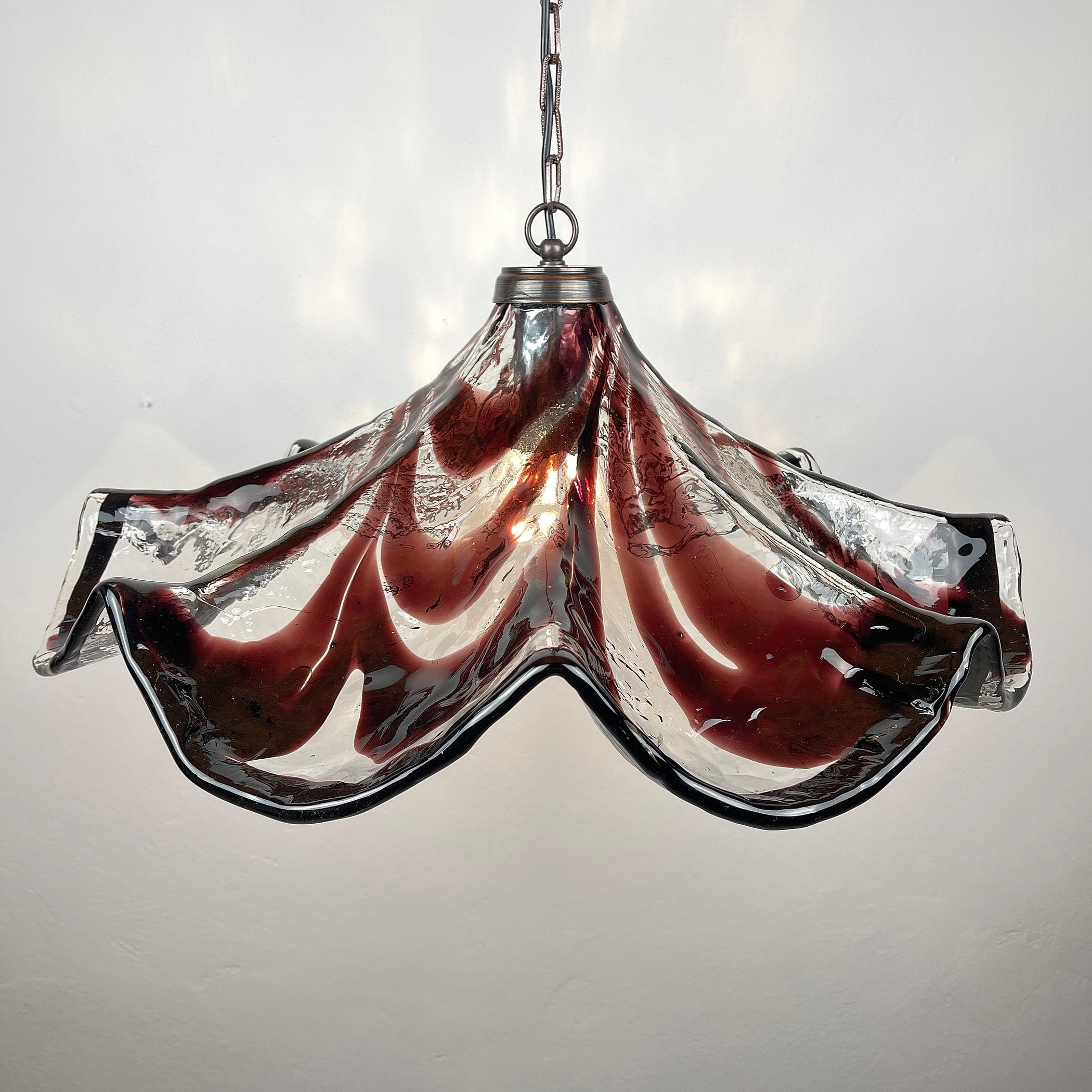 The extremely stunning Murano glass chandelier by Mazzega. Italian-made in the 1970s. Excellent condition. Need a screw-mounted, standard Edison E27 light. With cables, the chandelier is 85 cm tall. Appropriate for all countries throughout the