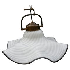 Murano glass pendant lamp with spiral vortex glass.