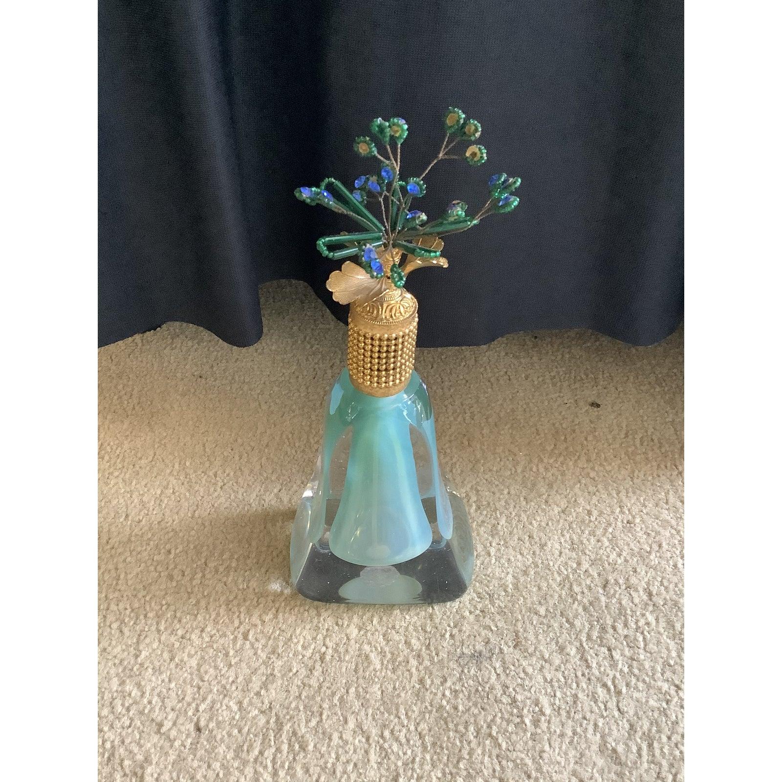 Murano glass perfume bottle with custom top by Irice. The bottle is clear with the inside being a beautiful aqua green. The atomizer is in working condition with a long plastic tube. The top has a very intricate brass fitting with leaves around it