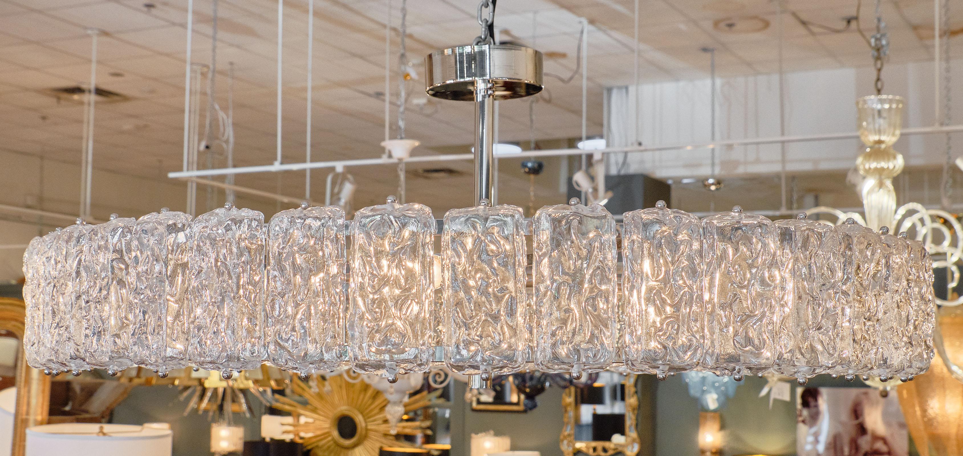 Murano Glass “Piastre” Chandelier with hand-blown textured glass components. We love the ice effect of the pieces! This fixture has been newly wired to fit US standards.
