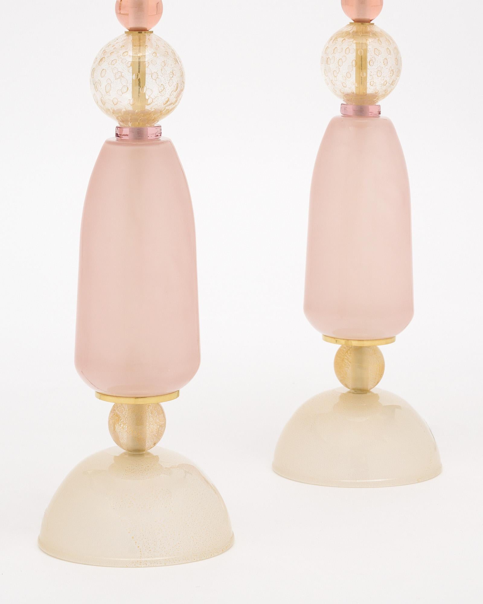Pair of hand-blown Murano glass lamps featuring unique glass components on a brass structure. In the style of iconic Italian designer Ettore Sotsass. We love the geometric forms and strong impact this pair brings to a space. We are drawn to the