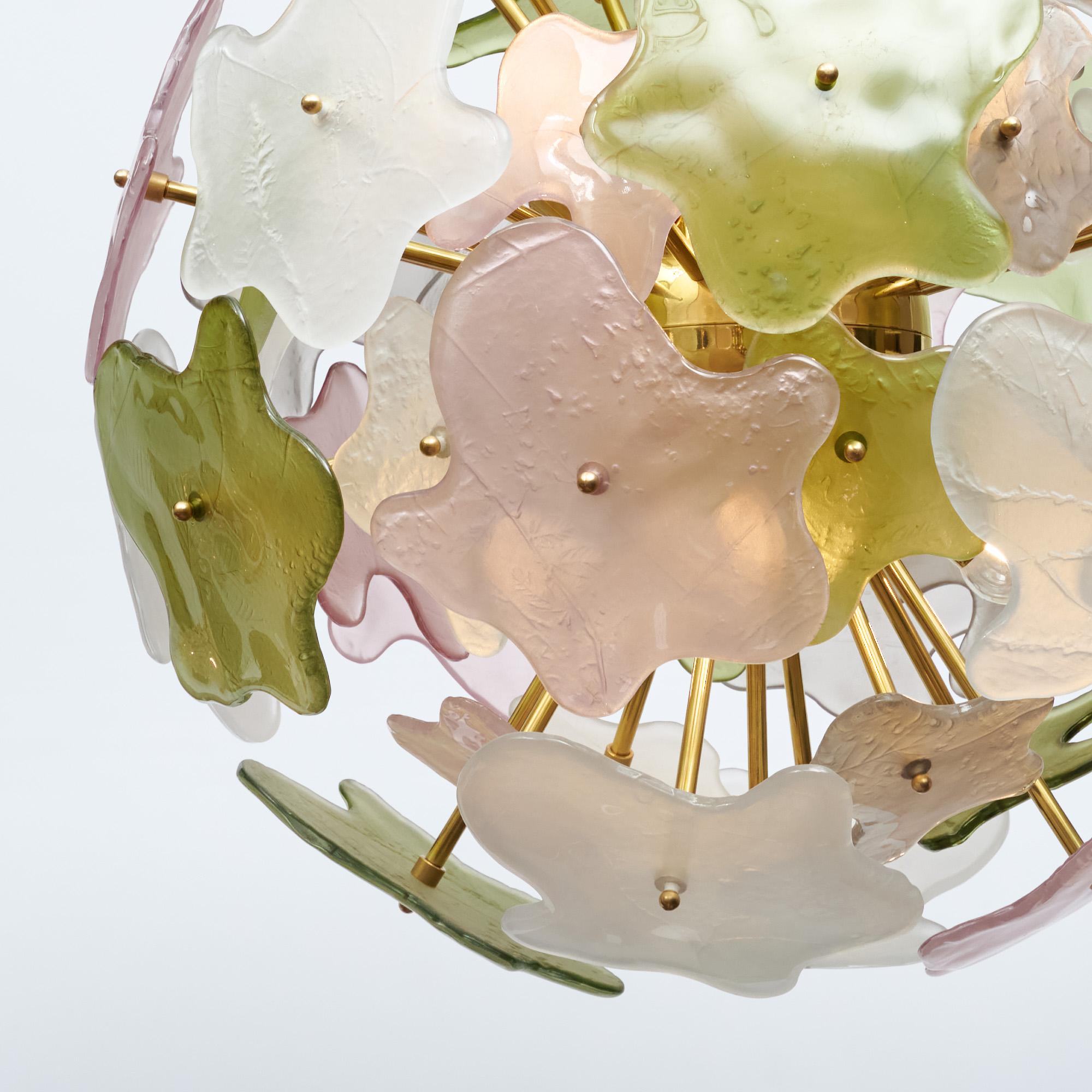 Sputnik chandelier from the island of Murano outside of Venice, Italy. This fixture is named ”Primavera“ for the beautiful spring colors of the glass – white, pink, and green. Each piece of glass also features lovely details of flowers and leaves
