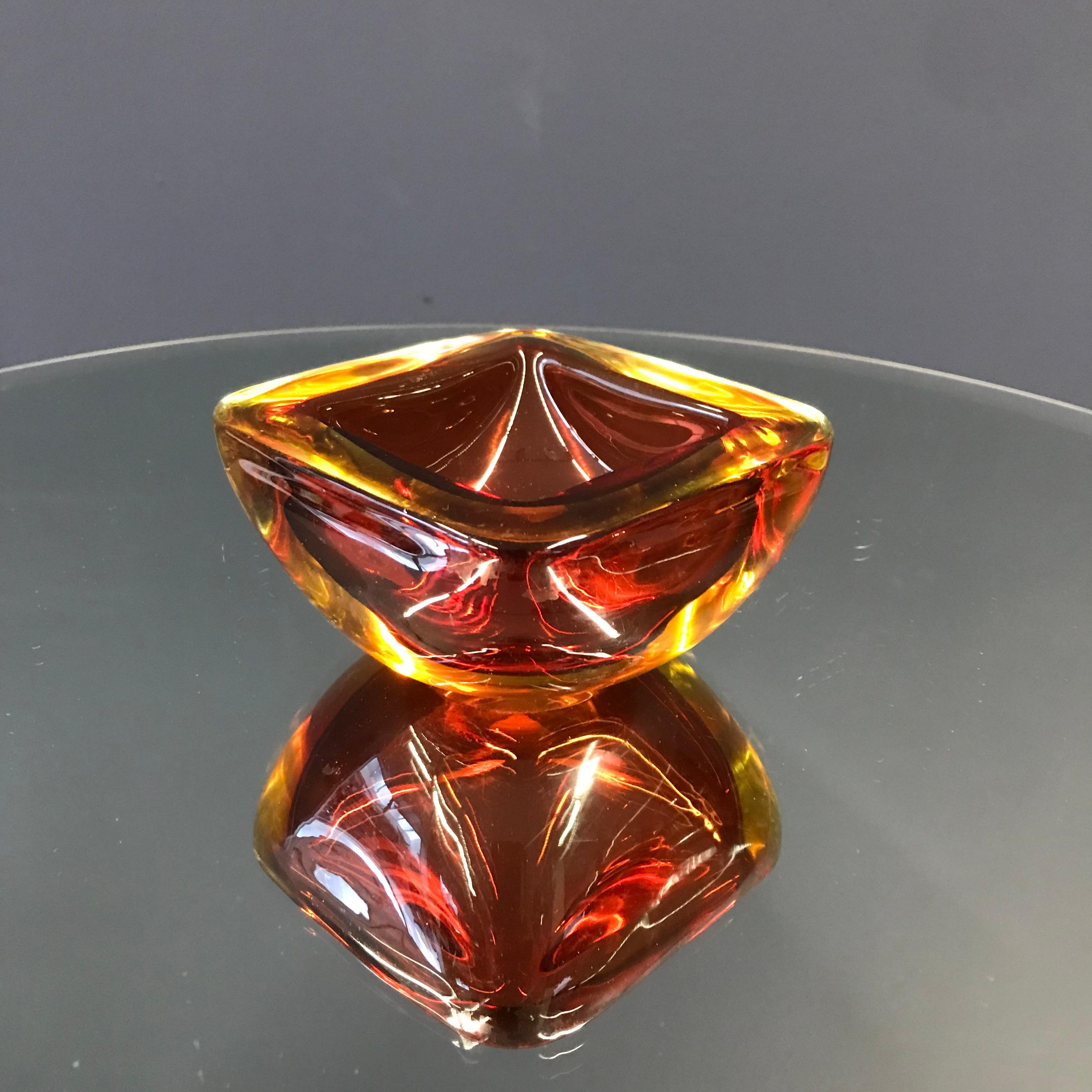 Add a bold pop of color to your smoking space with our vibrant red-orange ashtray—a stylish and functional accent piece designed to stand out.