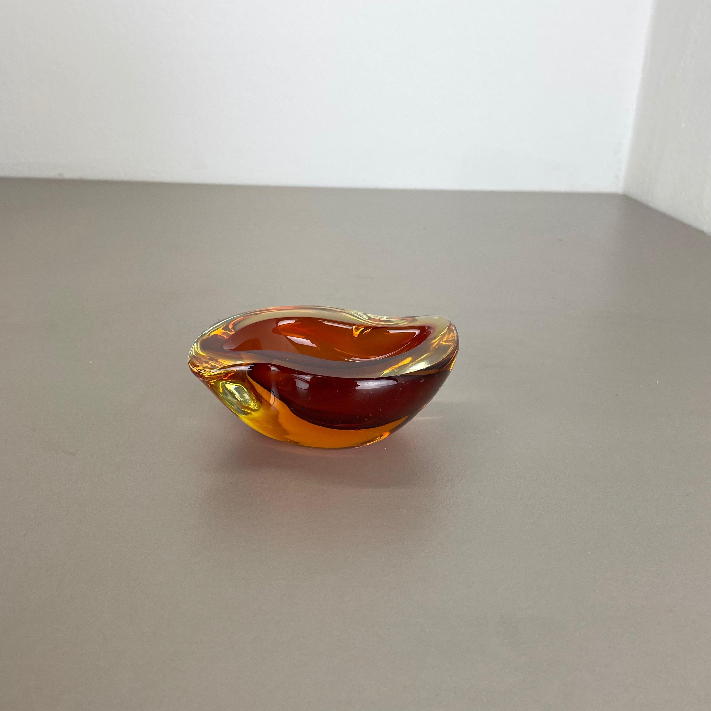 Article:

Murano glass bowl, ashtray element


Origin:

Murano, Italy


Decade:

1970s



This original vintage glass bowl element, ash tray was produced in the 1970s in Murano, Italy. It is made in Murano technique and has a fantastic form. The