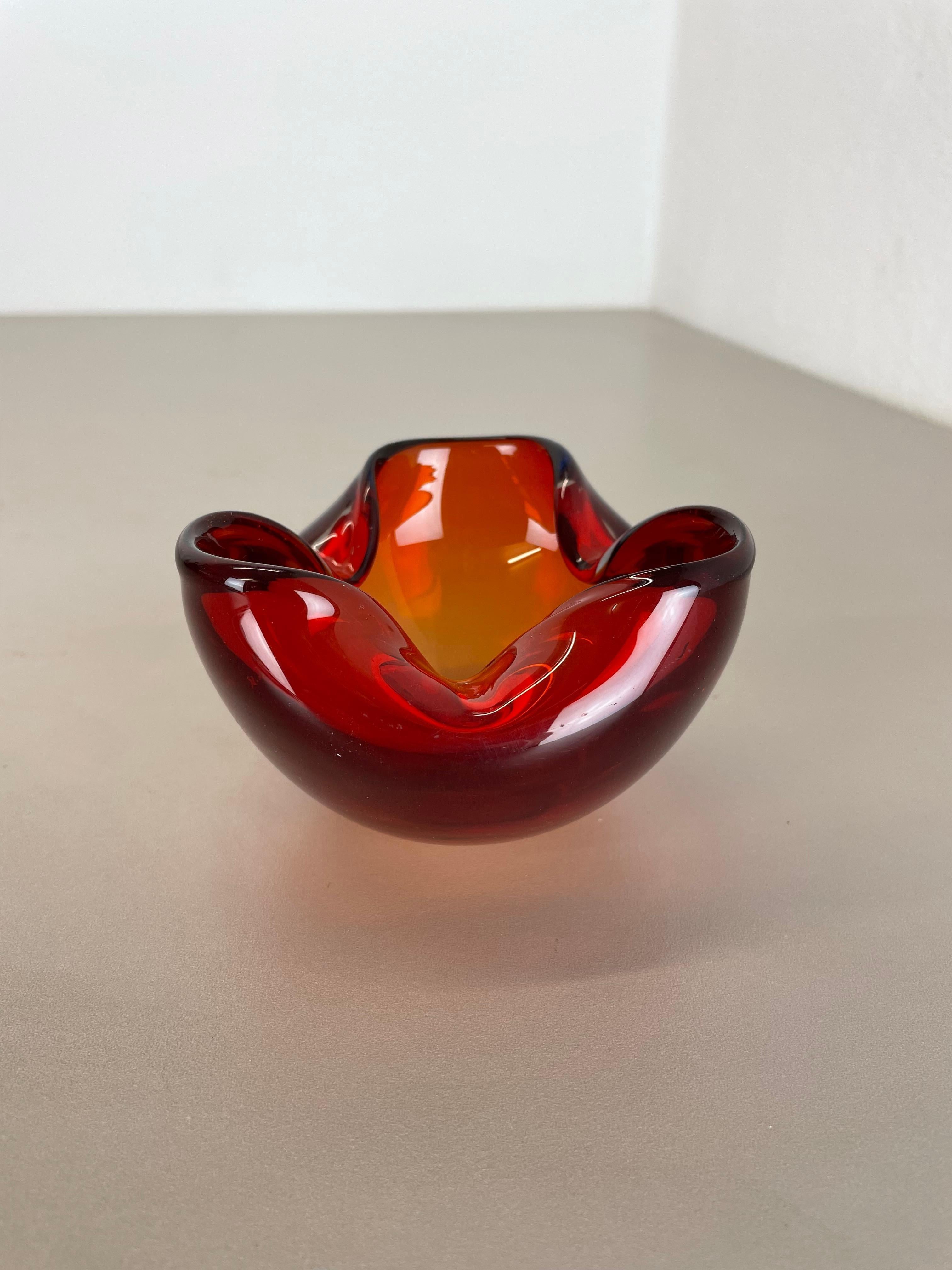 Article:

Murano glass bowl, ashtray element


Origin:

Murano, Italy


Decade:

1970s



This original vintage glass bowl element, ash tray was produced in the 1970s in Murano, Italy. It is made in Sommerso technique and has a fantastic organic