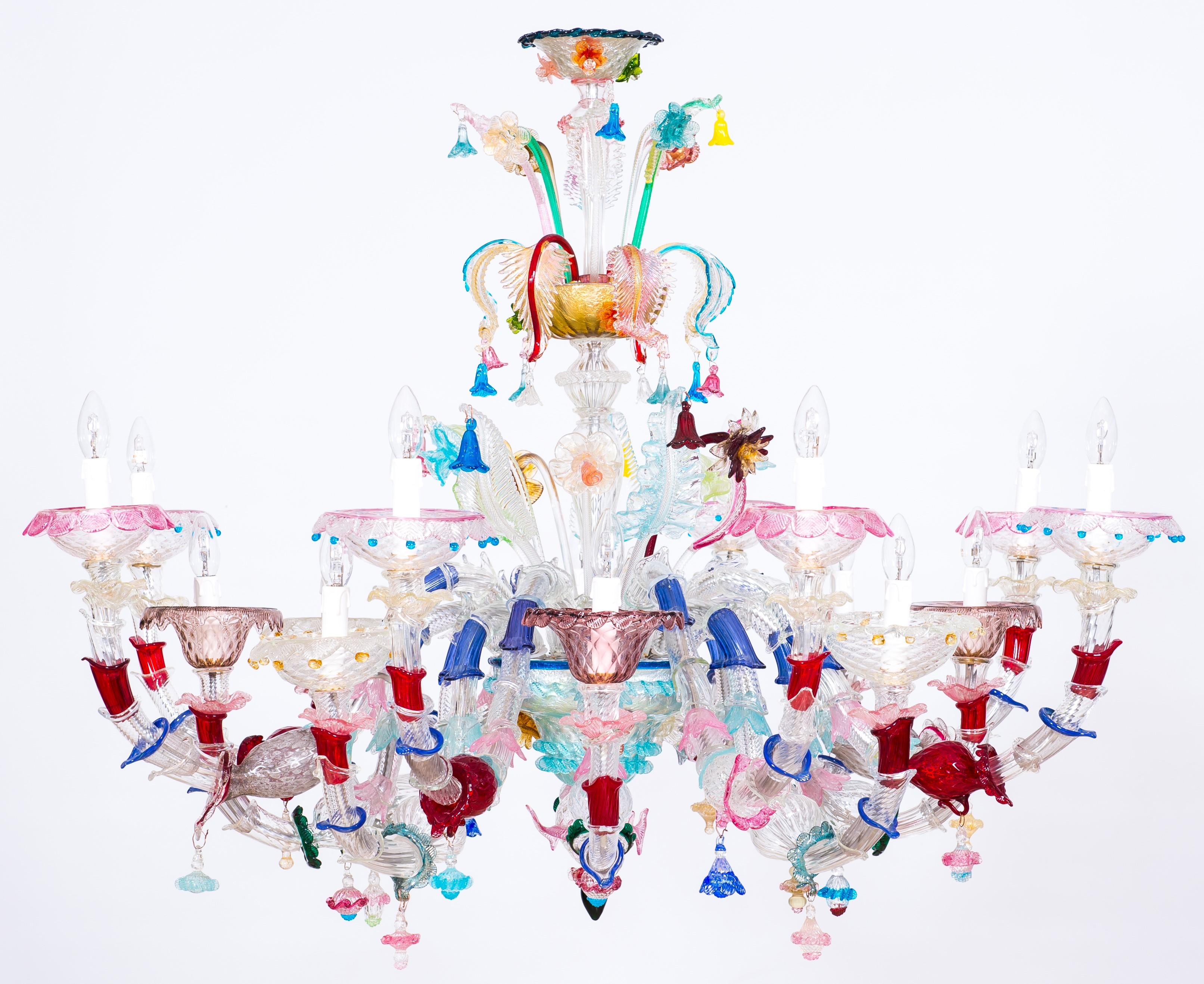 Murano glass rezzonico chandelier multicolored flowers 16 lights late 20th Italy
This chandelier stands out for its vivid multitude of colors, which make it an outstanding example of the best Murano glass art. 16 Arms spread out from the central