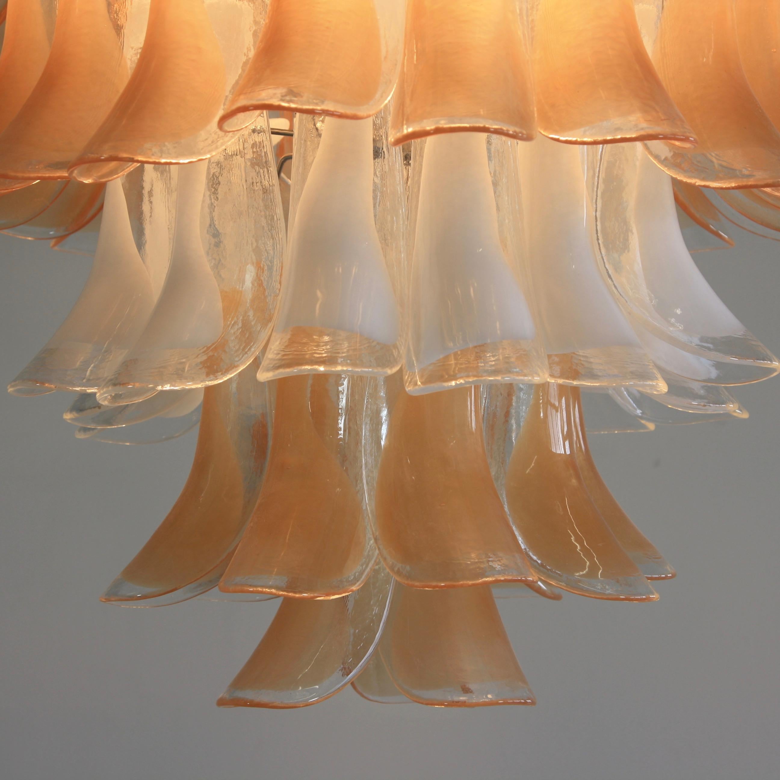 Murano glass 5-tier chandelier with saddle form glass, Italy, Murano, 1980s.

Chrome-plated steel frame with saddle form glass with peach and white coloration. With five light sockets.