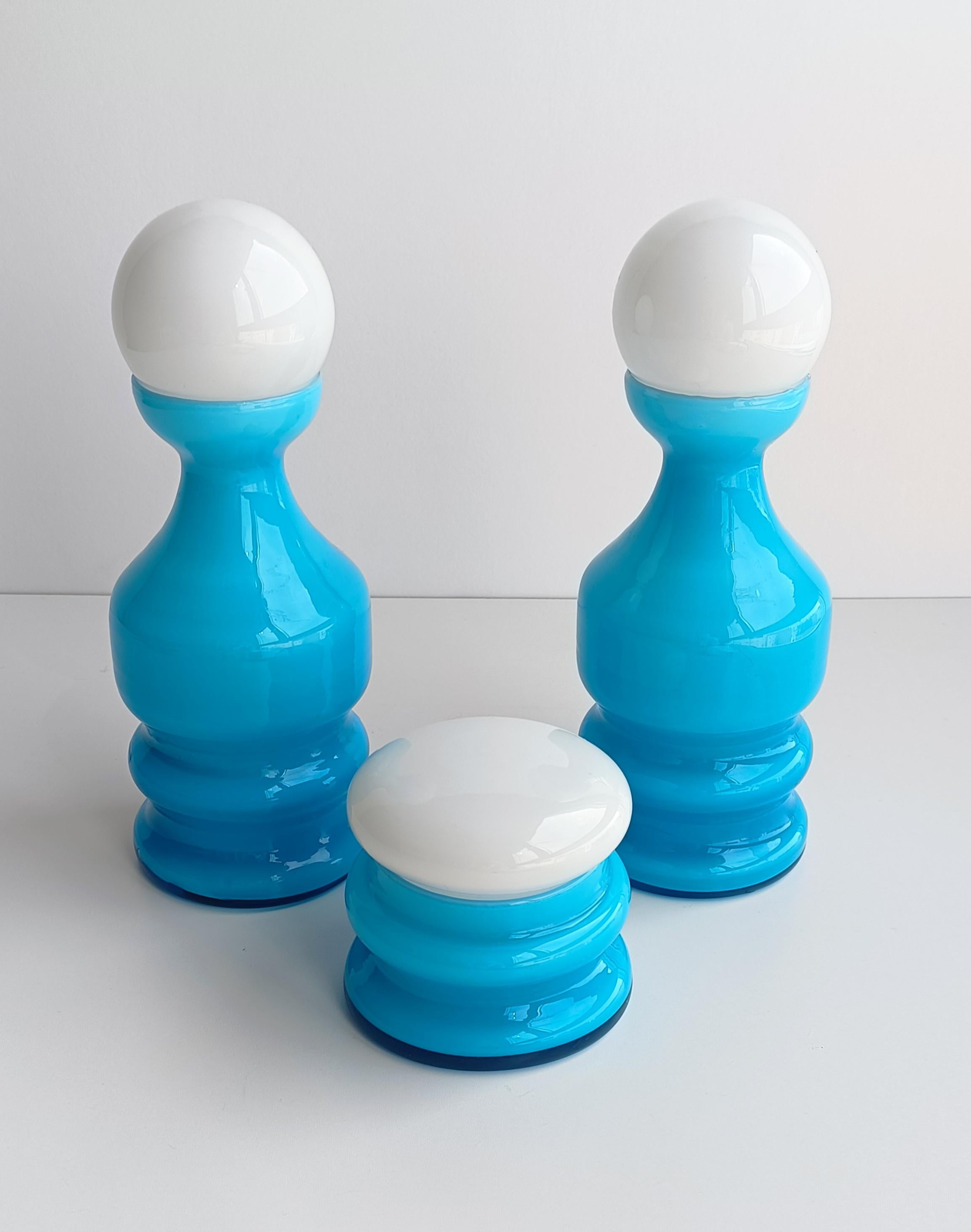Scandinavian style Murano cased glass hooped vases in a set of three. Originally designed to decorate vanity tables at ladies bedrooms. Strikingly beautiful in the hand. With original labels. Handcrafted in the island of Murano near Venice, Italy,