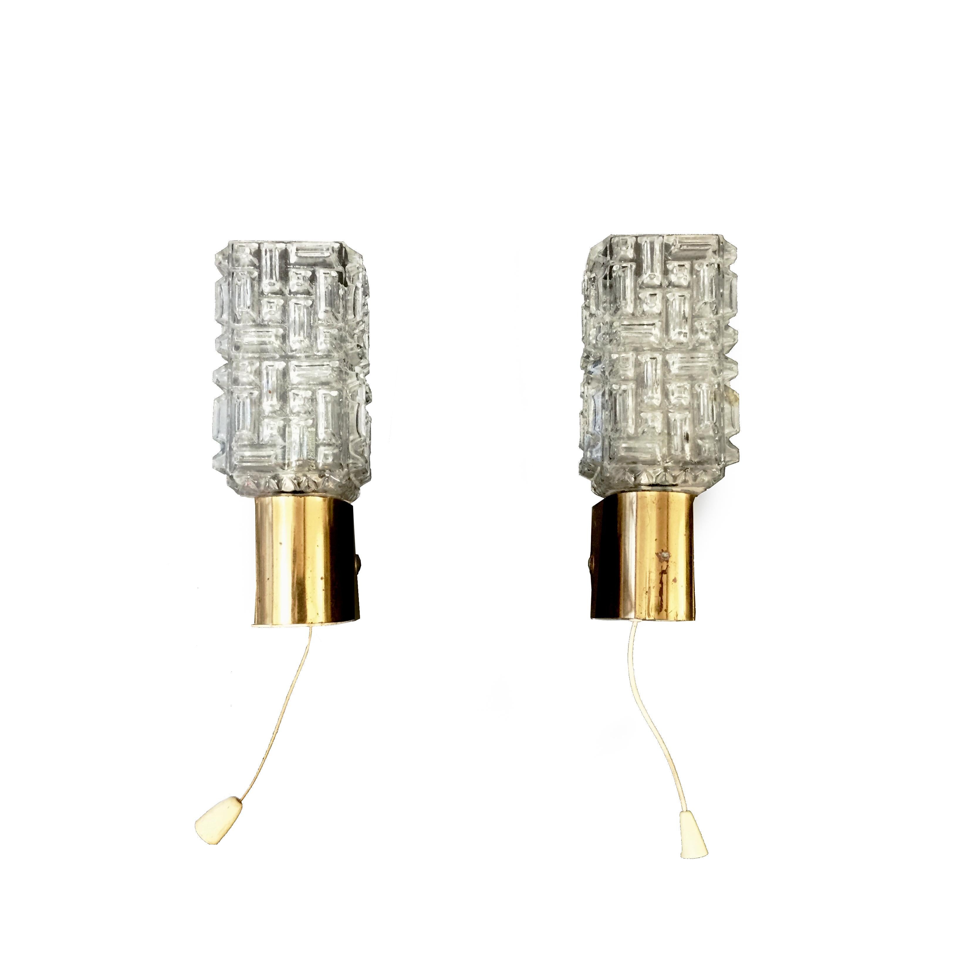Murano glass sconces with brass housing. Sold as a pair.

 