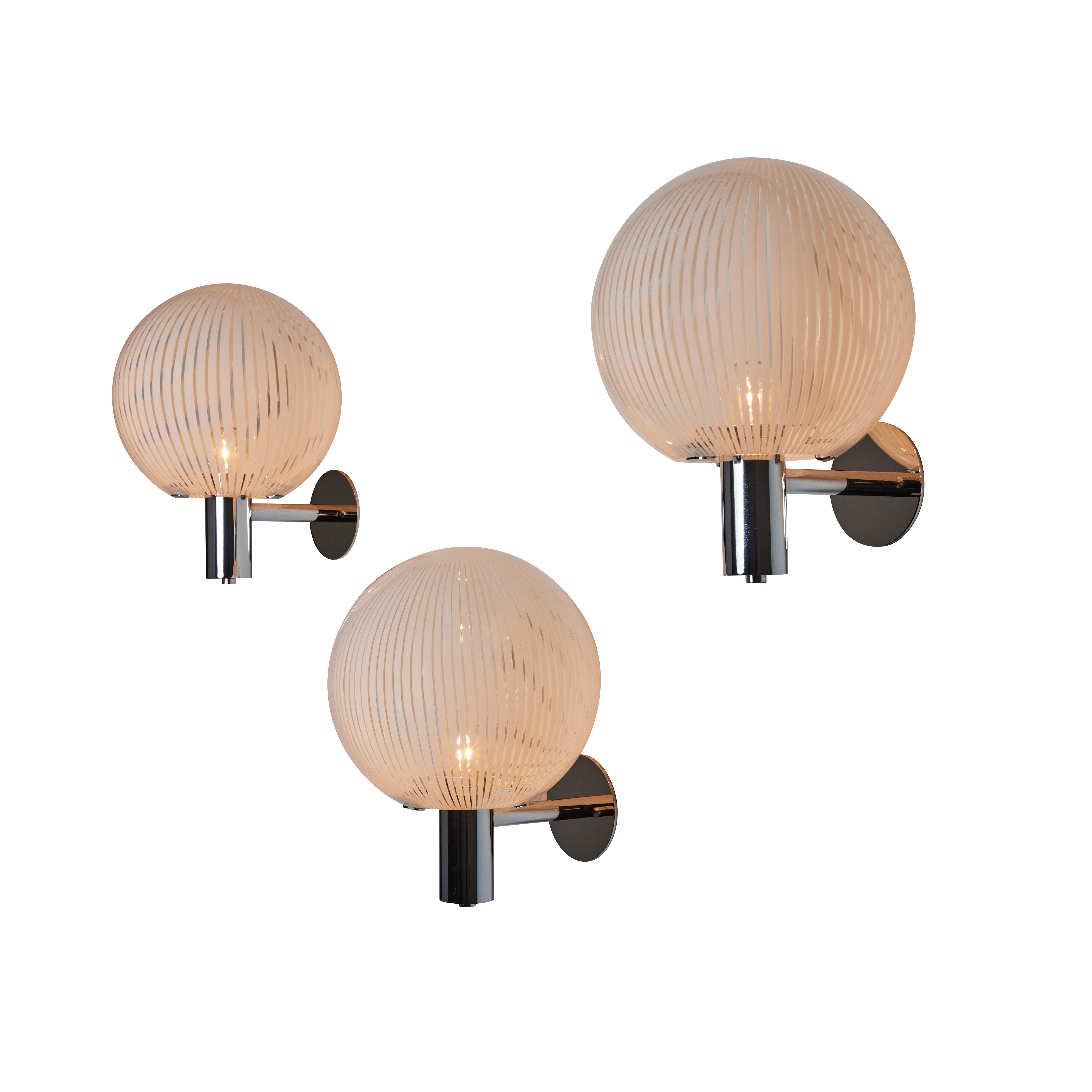 Murano Glass Sconces by Venini. Designed and manufactured in Italy, circa the 1950s. Beautiful Murano glass, allowing for a unique illumination, paired with chrome mounts. Rewired for U.S. standards. We recommend 1x E27 40W Max per fixture.