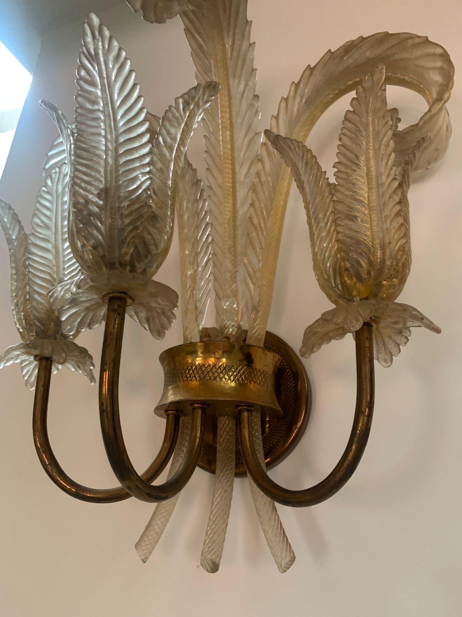 A tall single sconces  Murano glass with gold 