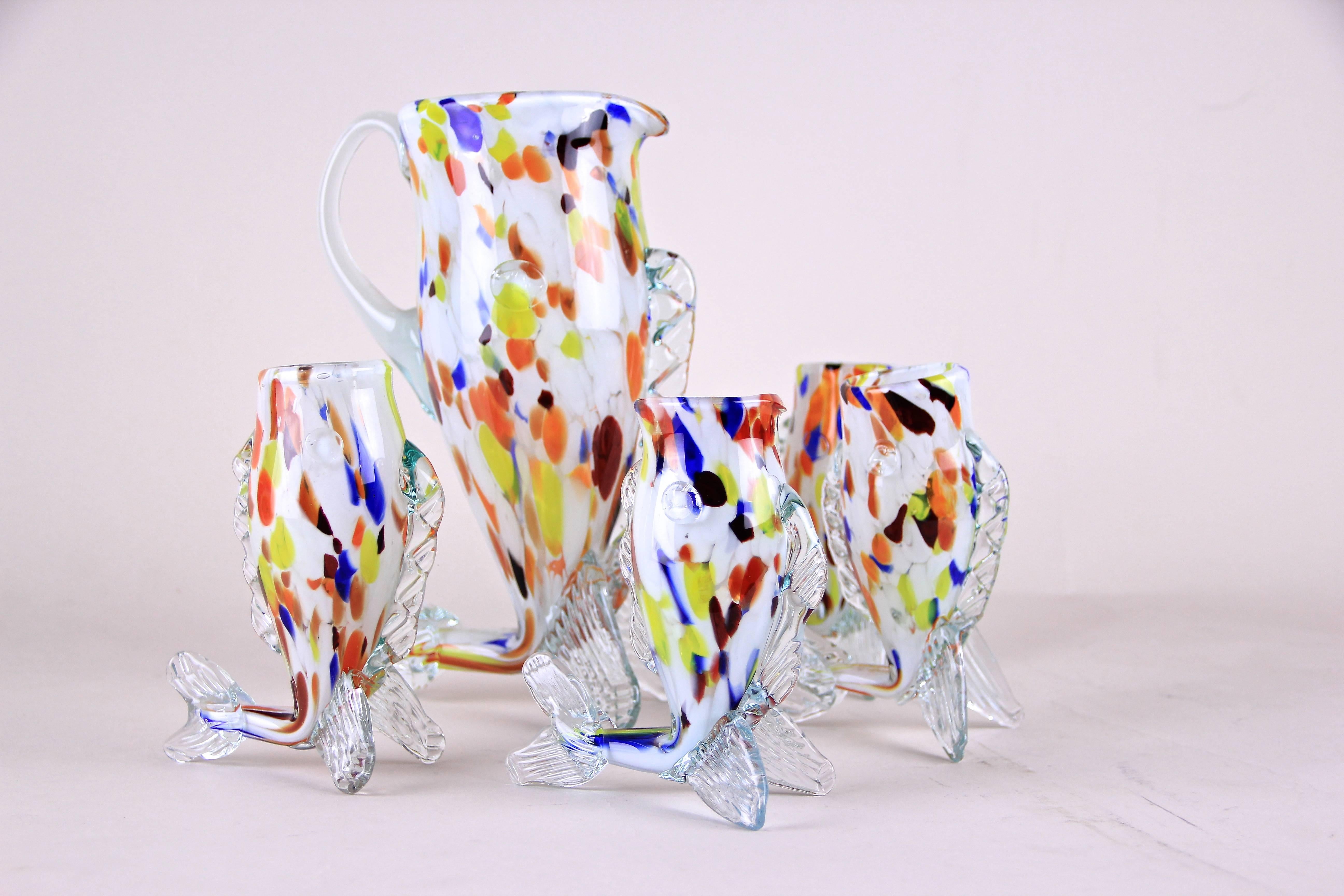 We present to you this out of the ordinary Murano Glass Service from Italy from the midcentury. This outstanding set of five Murano glasses consists of four little cups and a large jug. All incredible masterpieces were mouth blown and made to look