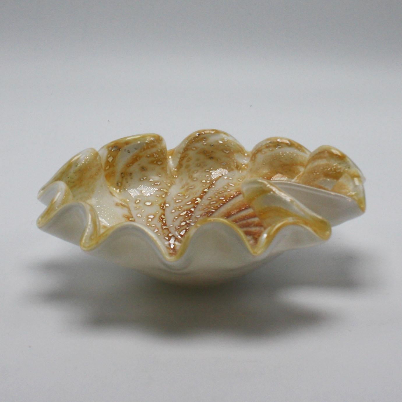 Murano glass shell bowl with gold flecks, circa 1970.
$325.