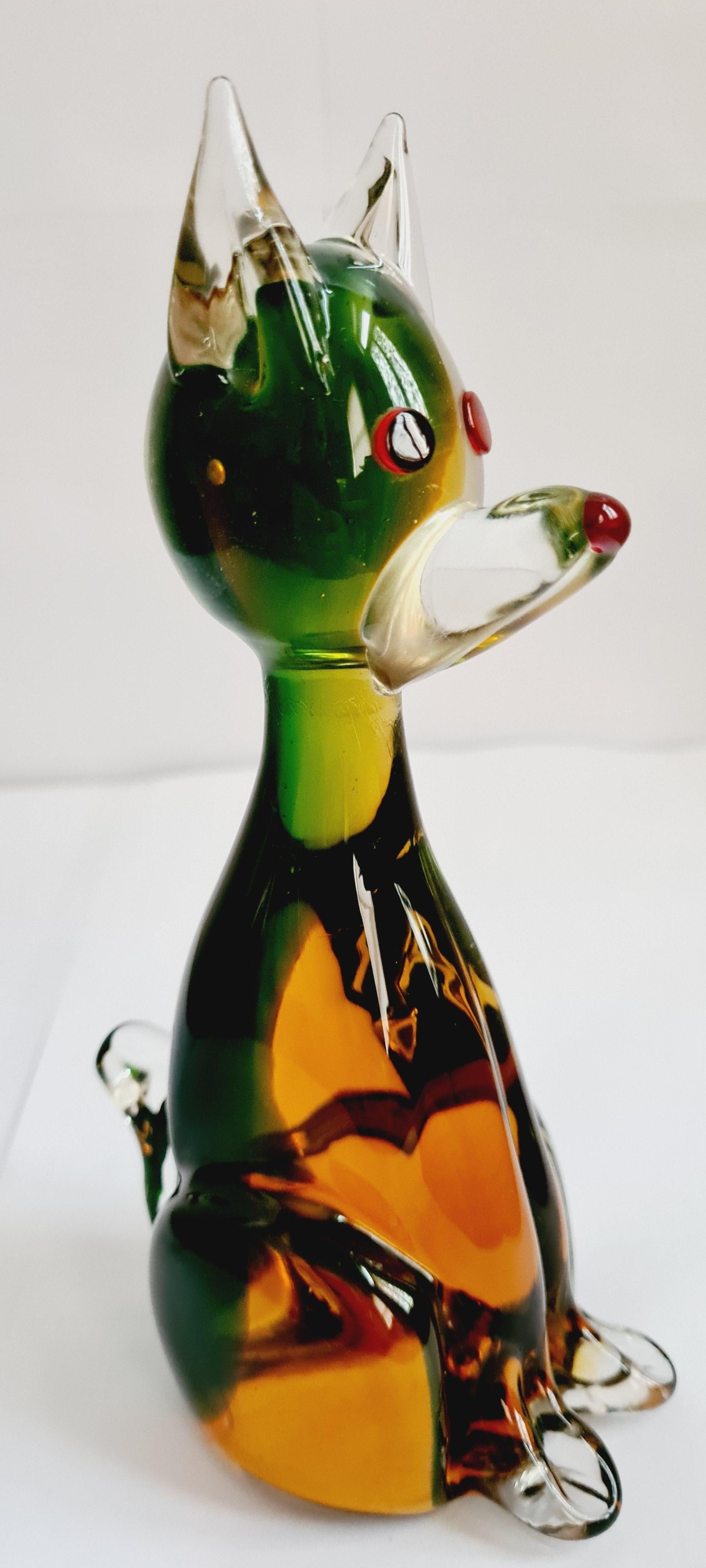 Beautiful Murano green/amber organic sommerso glass dog figurine in green, organic amber, red and clear; attributed to Antonio Da Ros for Vetri Cenedese. In excellent condition.
