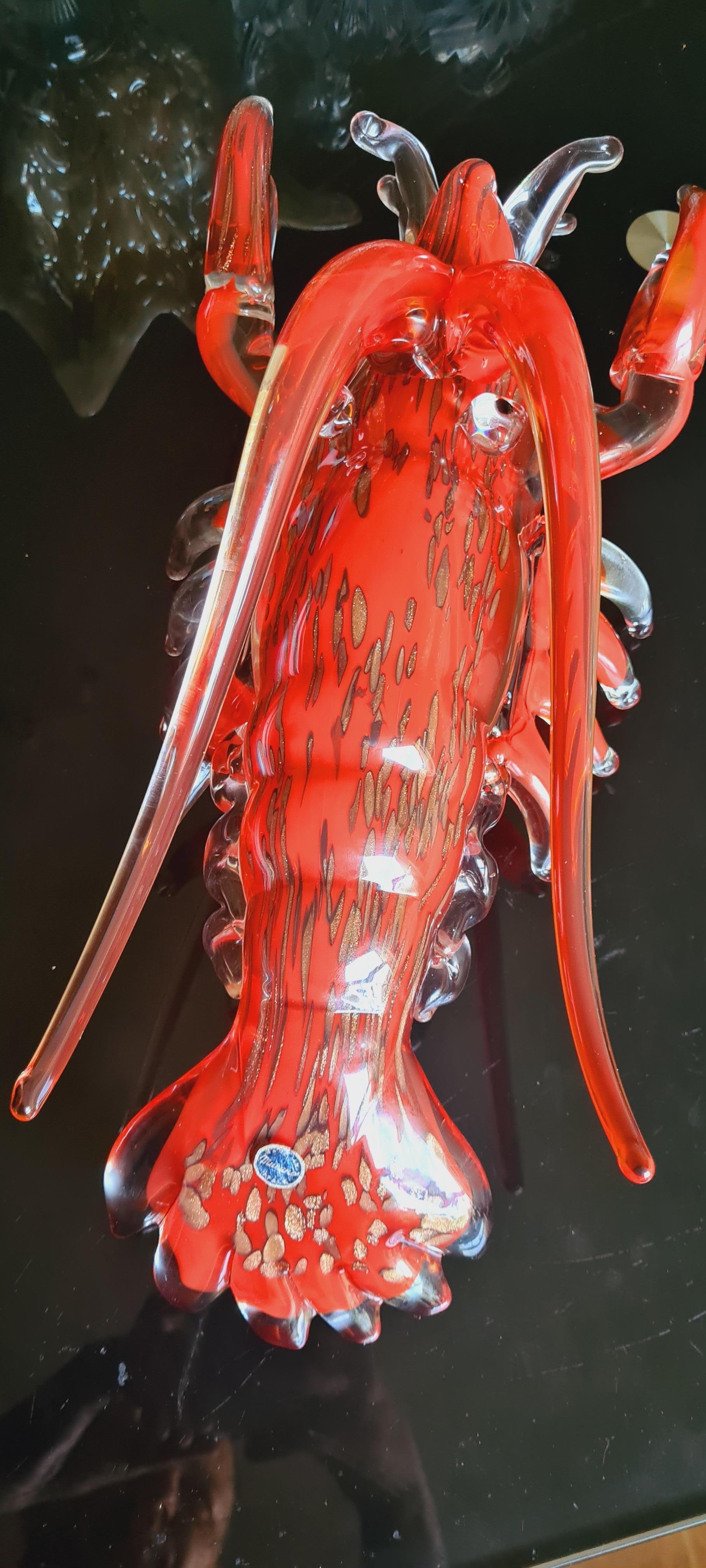 Beautiful vitange large Murano glass sommerso lobster in red, amber and clear colour with aventurine, attributed to Fratelli Toso; years 1960-1970. In excellent condition.