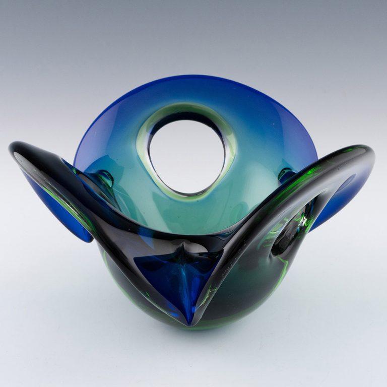 Heading : Murano glass Sommerso floriform bowl
Date : c1965
Origin : Murano, Italy
Bowl Features : Floriform with deep blue and emerald glass
Type : Lead
Size : 13cm height, 24cm max width
Condition : Excellent, no chips or cracks
Restoration :