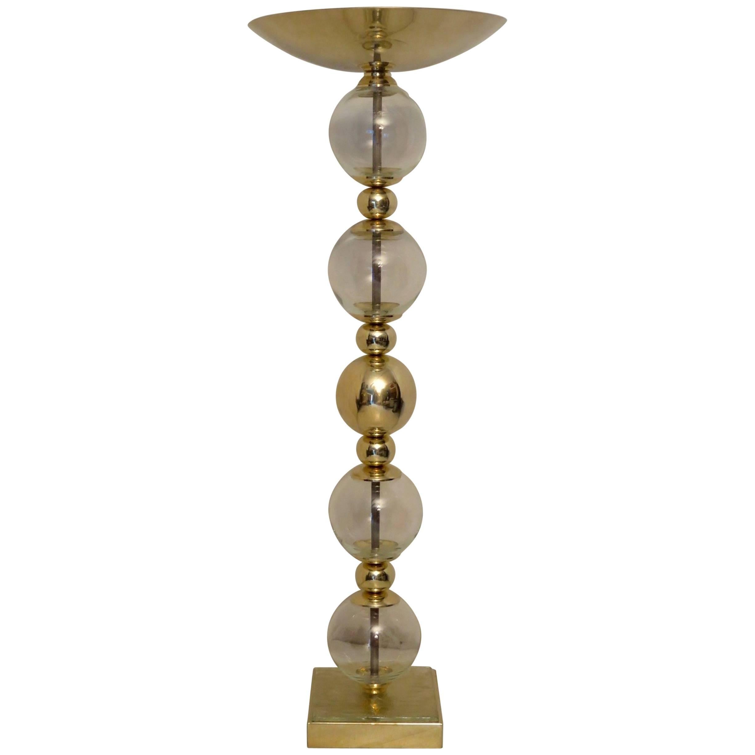 Murano floor lamp from the 1980s, all in Murano Art glass and brass.

It is composed of transparent Art glass spheres and brass spheres, which alternate with one another. The glass ones are four large transparent spheres, of a beautiful glass that