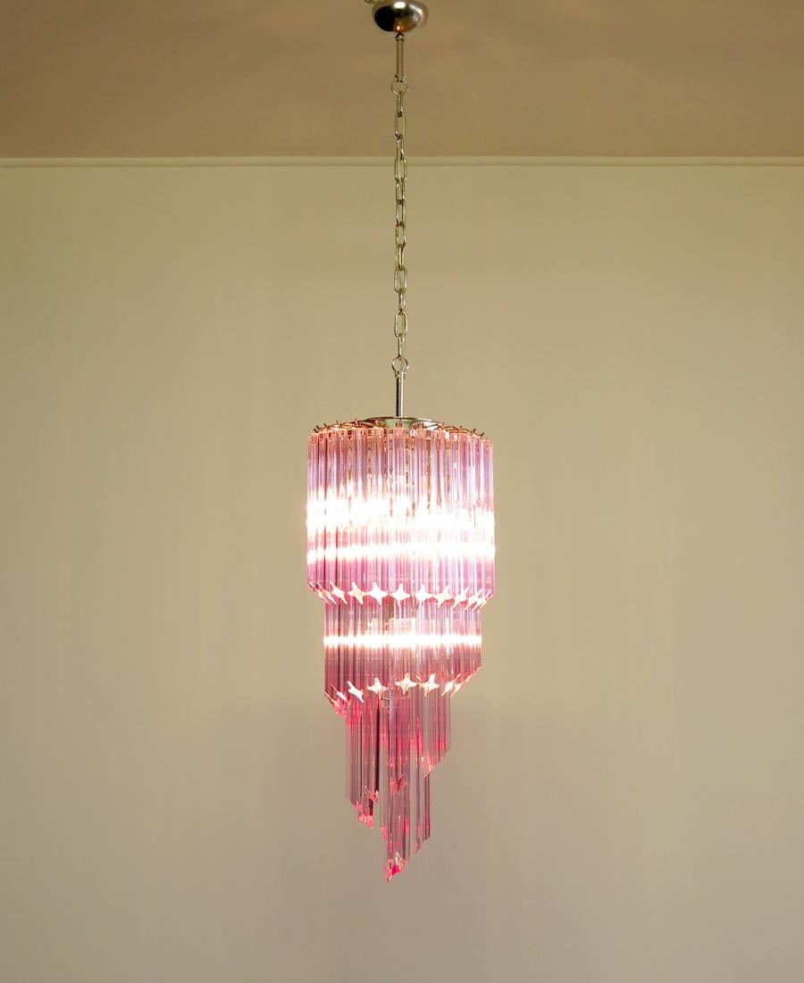 Fantastic Murano chandelier made by 54 Murano pink crystal prism (quadriedri) in a chrome metal frame. The shape of this chandelier is spiral.
Period: 1980s-1990s
Dimensions: 63 inches height (160 cm) with chain; 35.45 inches height (90 cm)