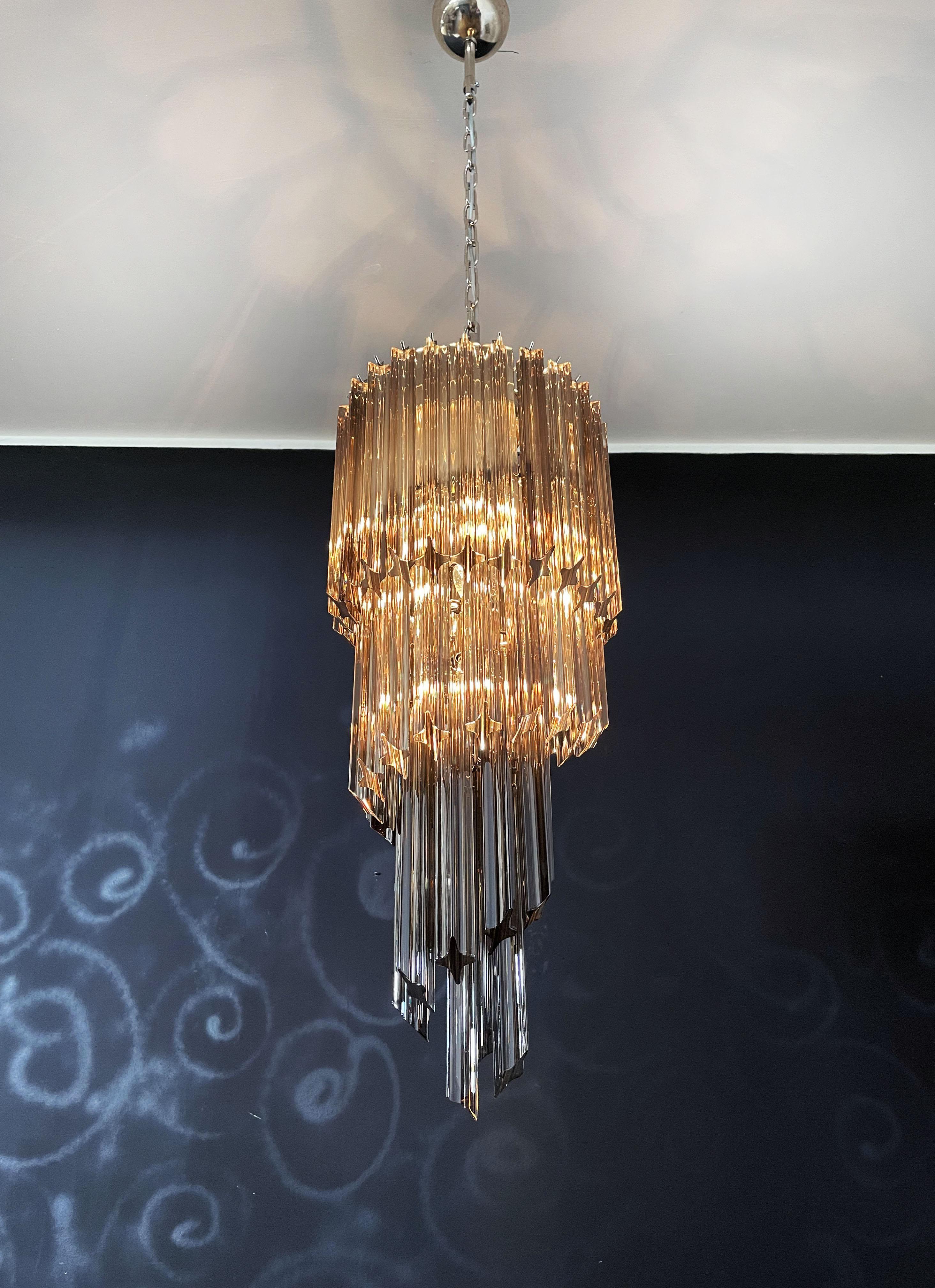 Fantastic Murano chandelier made by 54 Murano smoked crystal prism (quadriedri) in a chrome metal frame. The shape of this chandelier is spiral.
Period: late XX century
Dimensions: 63 inches height (160 cm) with chain; 35,45 inches height (90 cm)