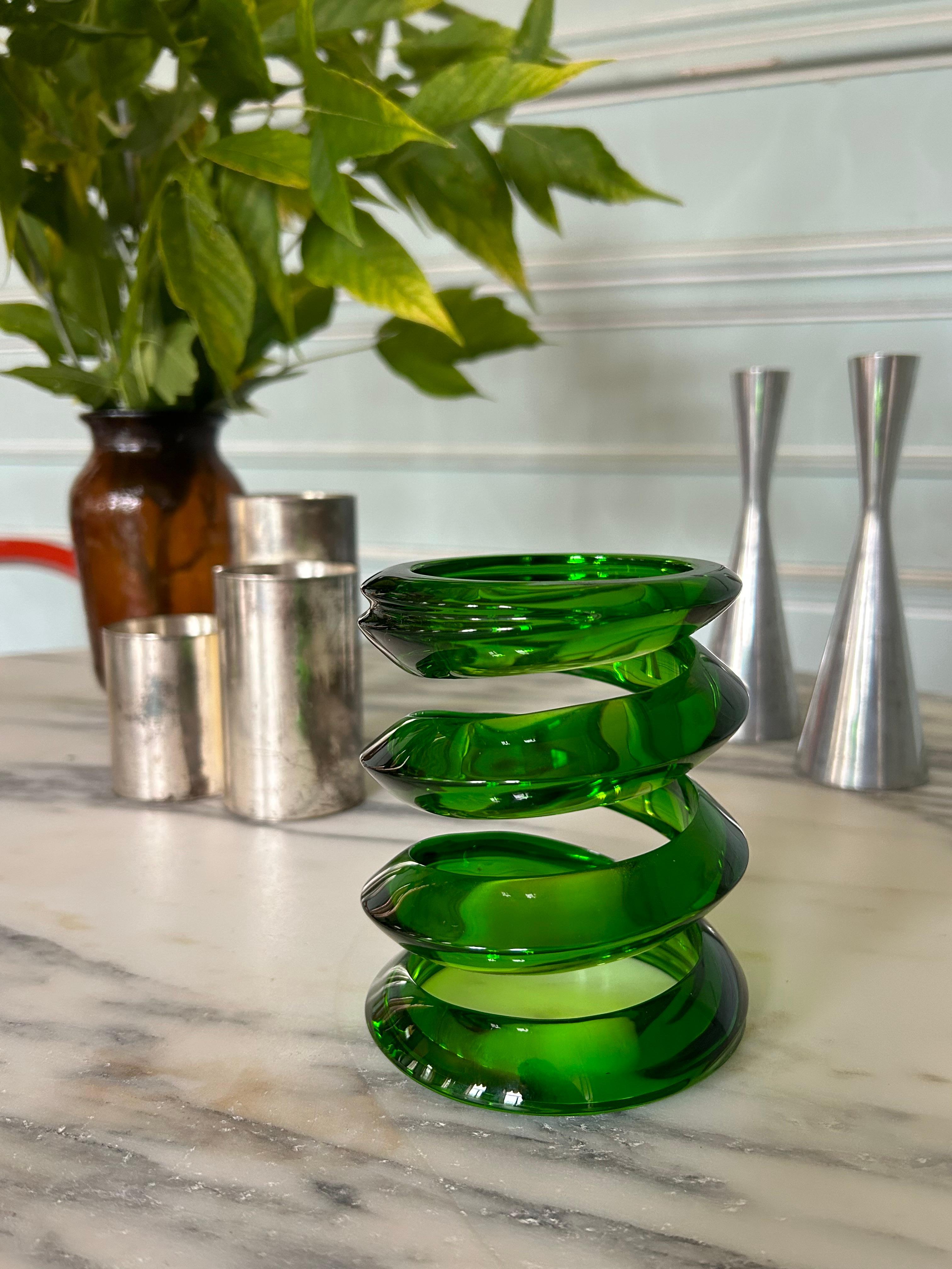 Green Murano glass spiral sculpture. The color is exquisite, and the movement of the spiral perfectly balanced. A striking piece that will bring character and distinction to any space.