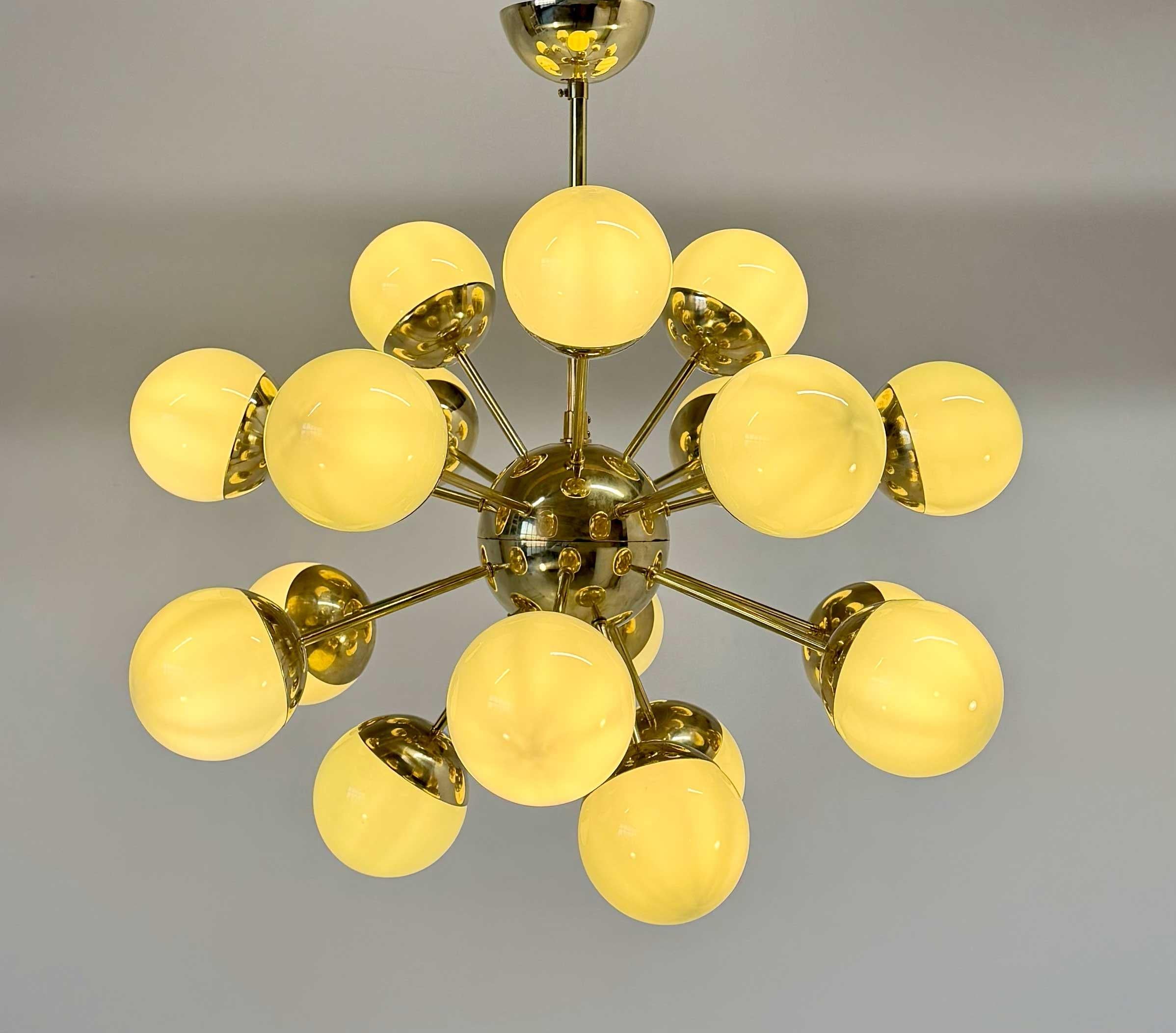 This Sputnik chandelier is crafted in Murano using authentic Murano glass, featuring sage green glass globes combined with a refined brass structure.
Inspired by mid-century aesthetics, its dynamic composition creates a balanced and sculptural
