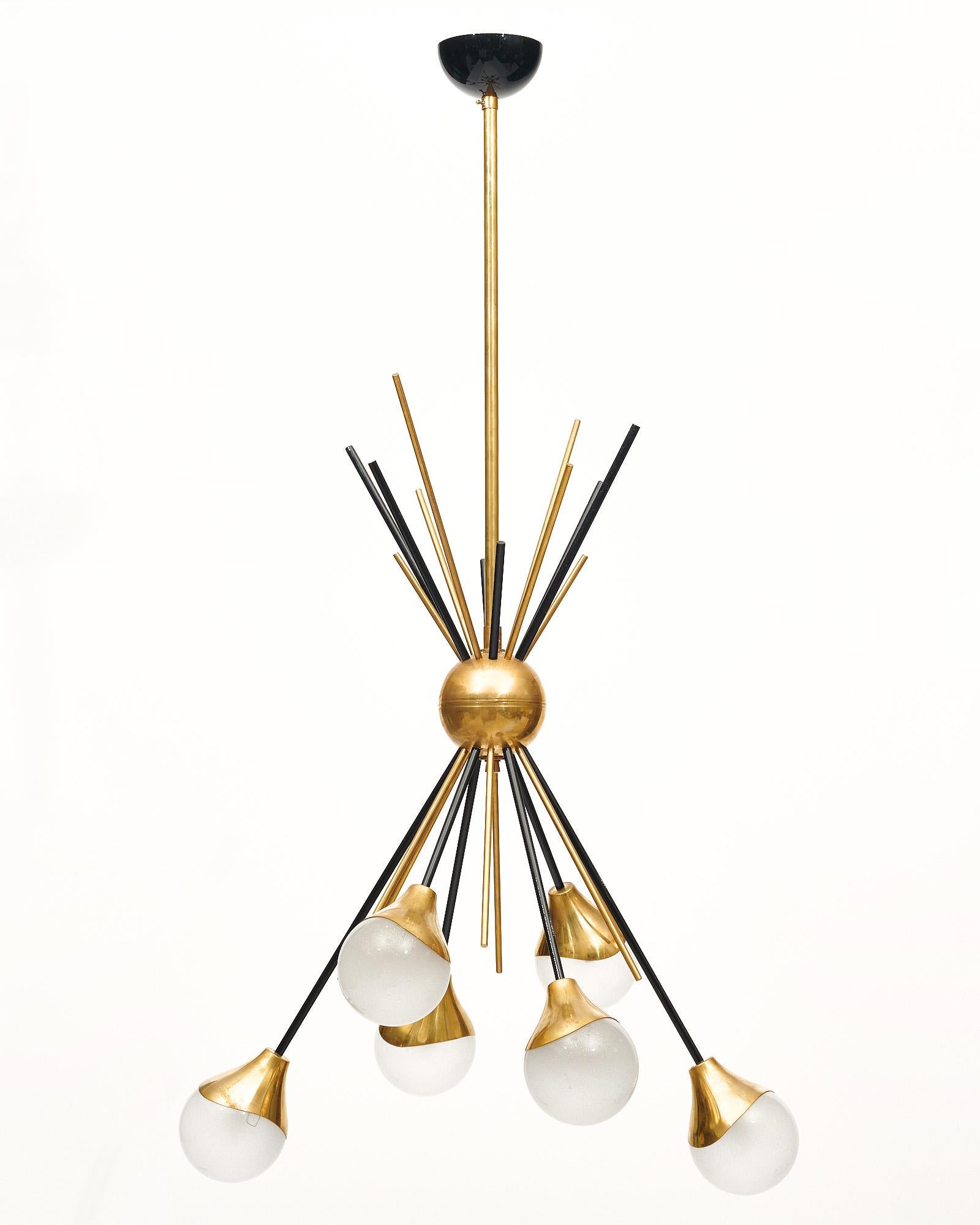 Chandelier from the island of Murano, Italy. This piece is hand-crafted in the Stilnovo style. The structure is made of brass with black lacquered elements. The rods feature pearlescent hand-blown Murano glass globes. This fixture has been newly