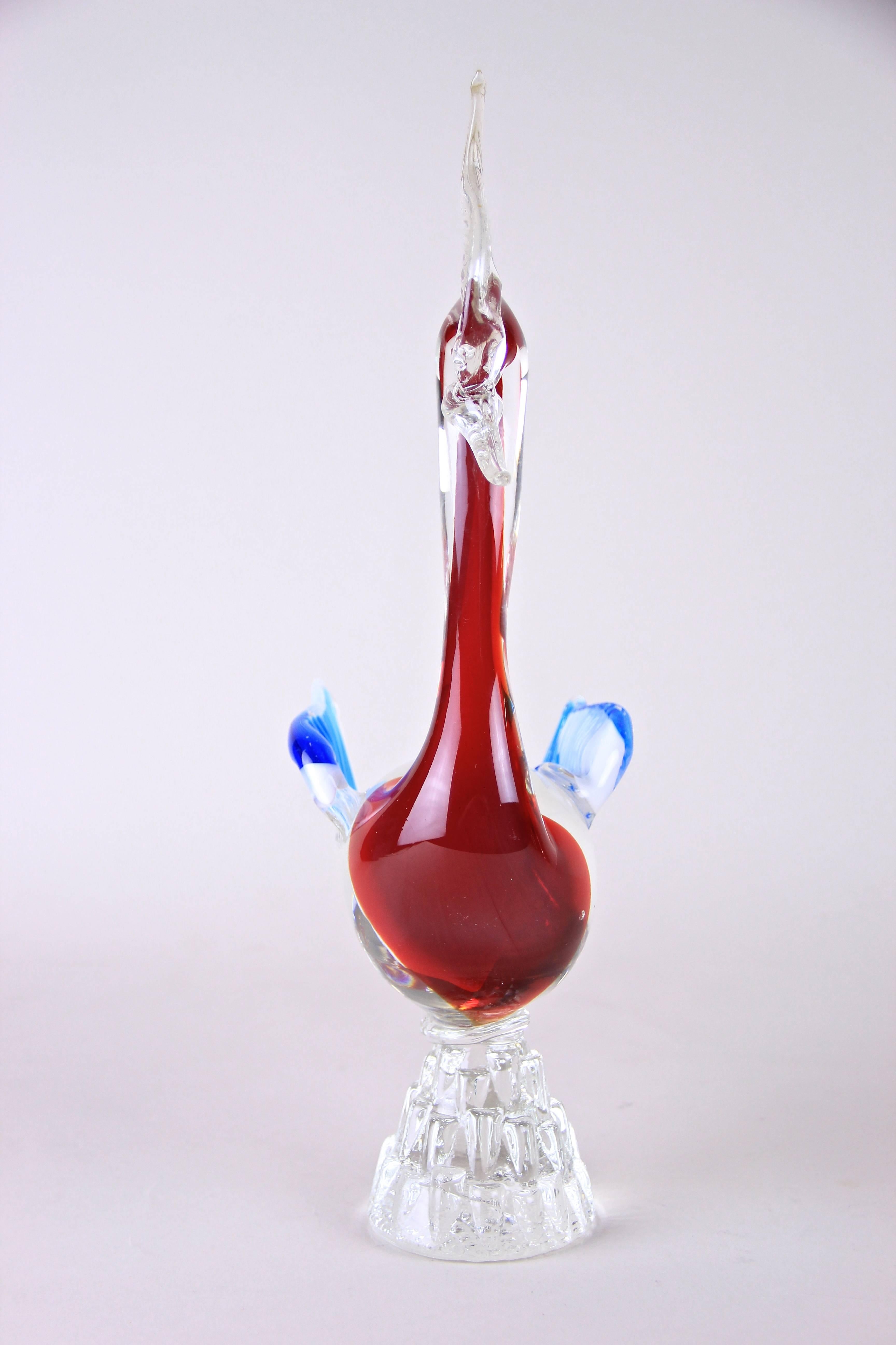 Incredible crafted Murano Glass Art Swan from the famous Murano Glass workshops out of bella Italia around the midcentury. The red/white body in combination with the blue/white colored wings reminds on the US flag and just looks gorgeous!