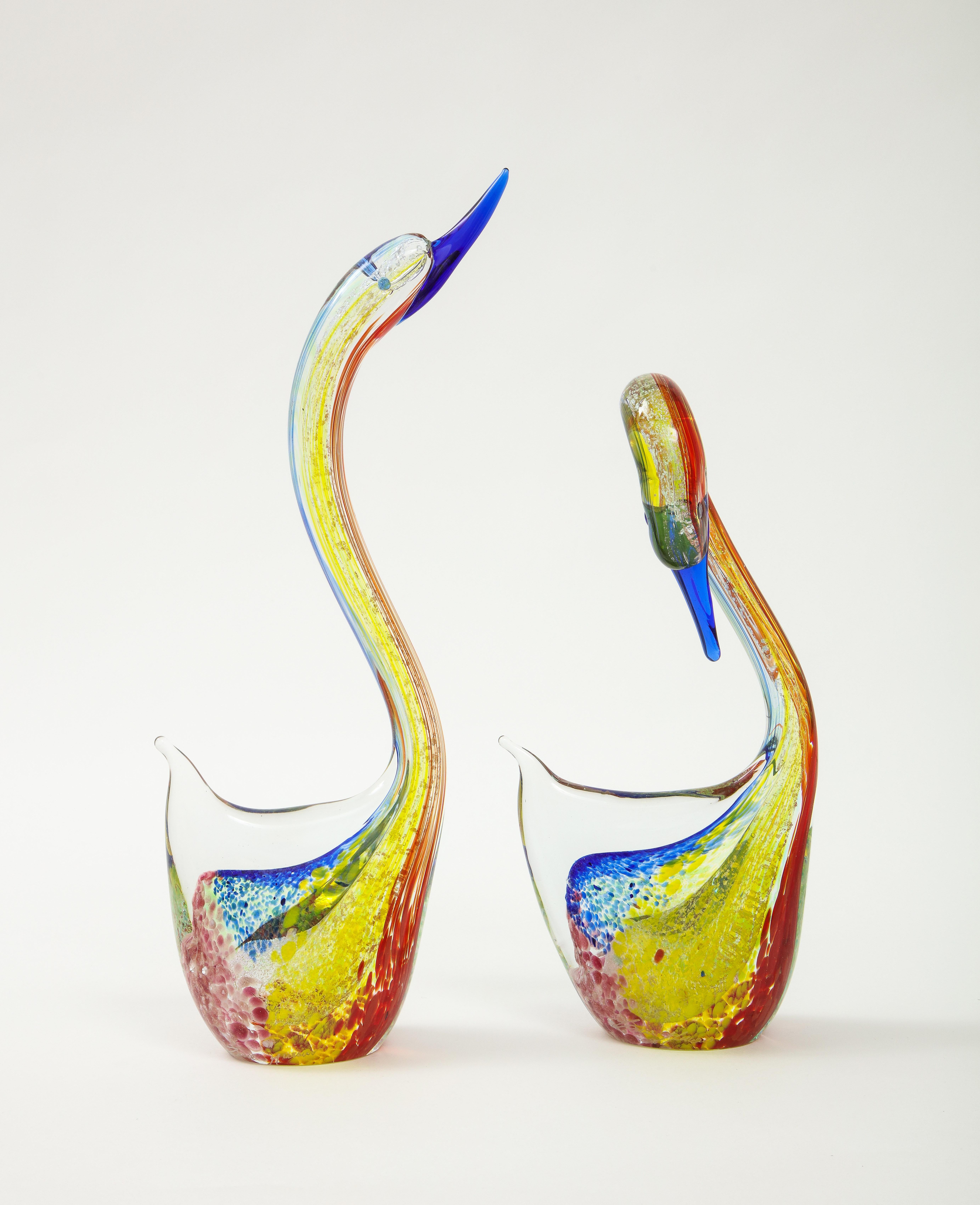 1980s modern Murano glass swans sculptures signed and label, in vintage original condition with minor wear and patina due to age and use.

Smaller swan measurements are: width 5.5'' depth 2.5'' height 10.5''