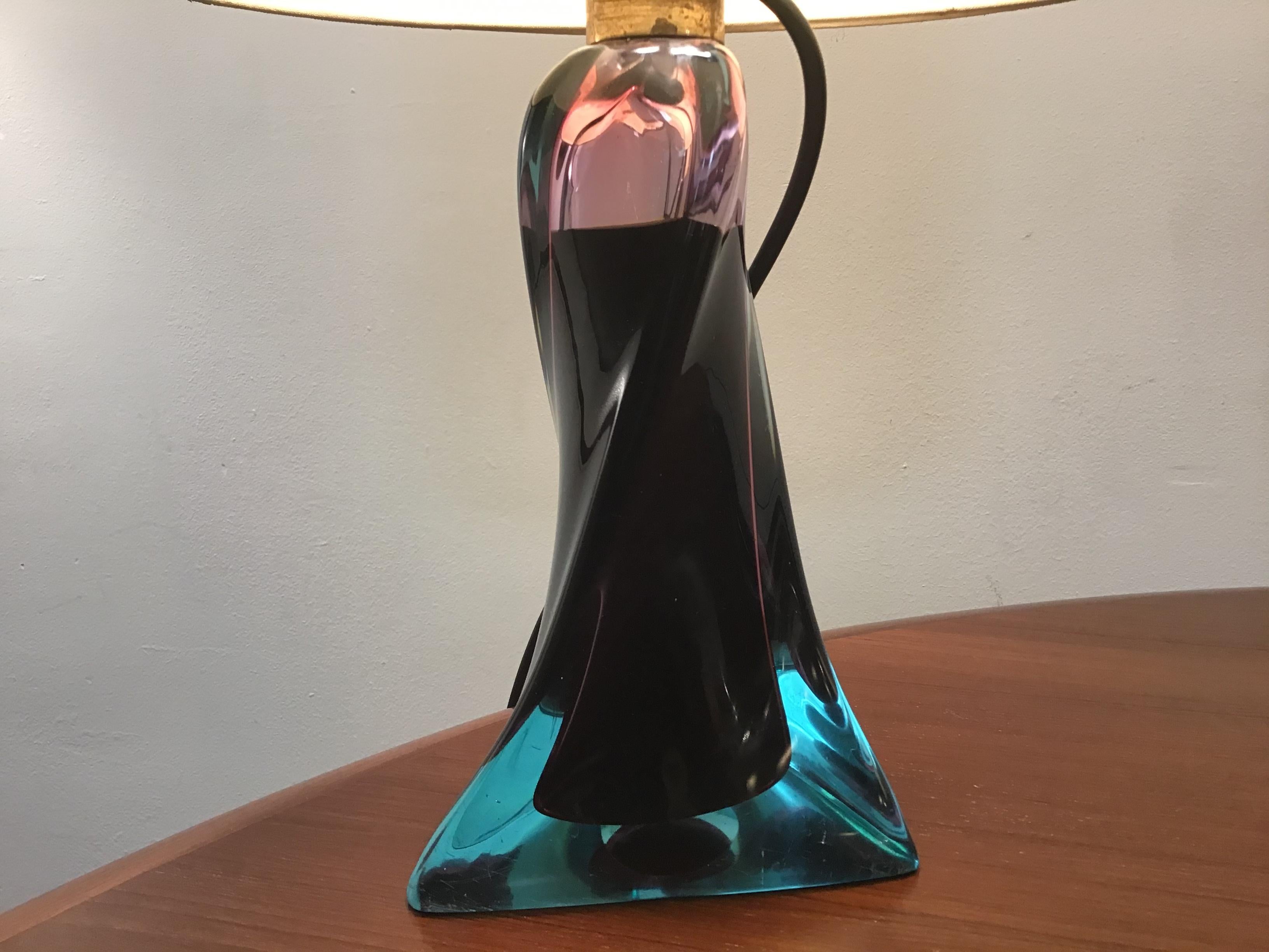 A stunning pair of Murano glass table lamp with deep blue original shades
Both lamps are filled with liquid which bounces the light 
circa 1960 Italian.
