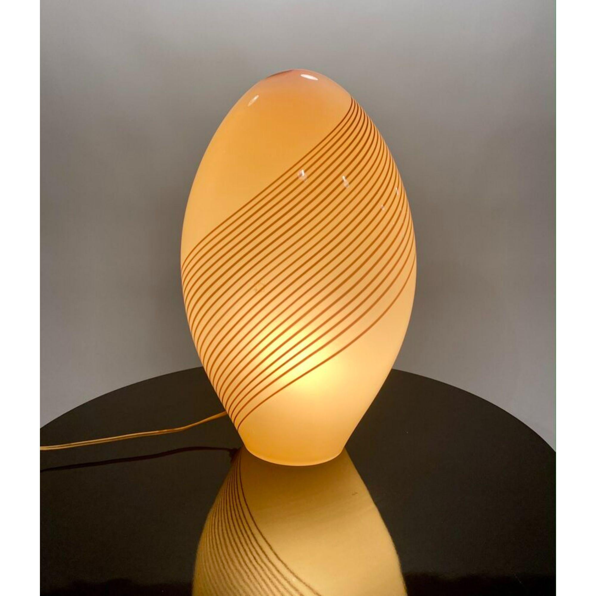 Mid-Century Modern Murano glass table lamp. Designed by Lino Tagliapietra for Effetre International Company, Italy.

Additional Information:
Materials: Murano Glass
Style: Mid-Century Modern Postmodern
Designer: Lino Tagliapietra
Brand: