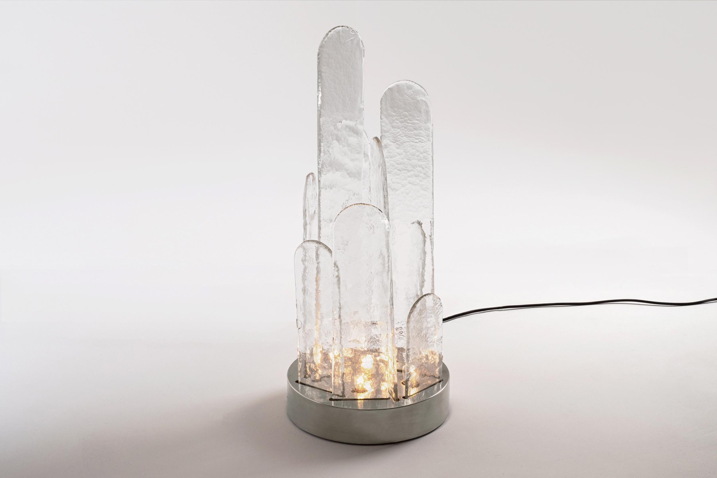 Spectaculair table lamp by Luigi Massoni for ITER Elettronica, Italy 1970s. Large and heavy pieces of clear Murano glass in different sizes and a nickel plated base. The glass pieces show a beautiful characteristic structure imprint which catches