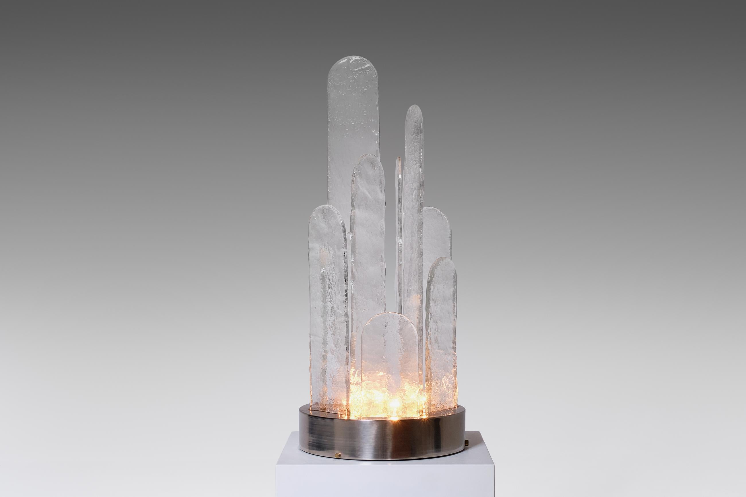 Spectacular table lamp by Luigi Massoni for ITER Elettronica, Italy, 1970s. Constructed of large and heavy pieces of solid, clear Murano glass, which are shaped in several different sizes, and a nickel plated base. The glass elements show a