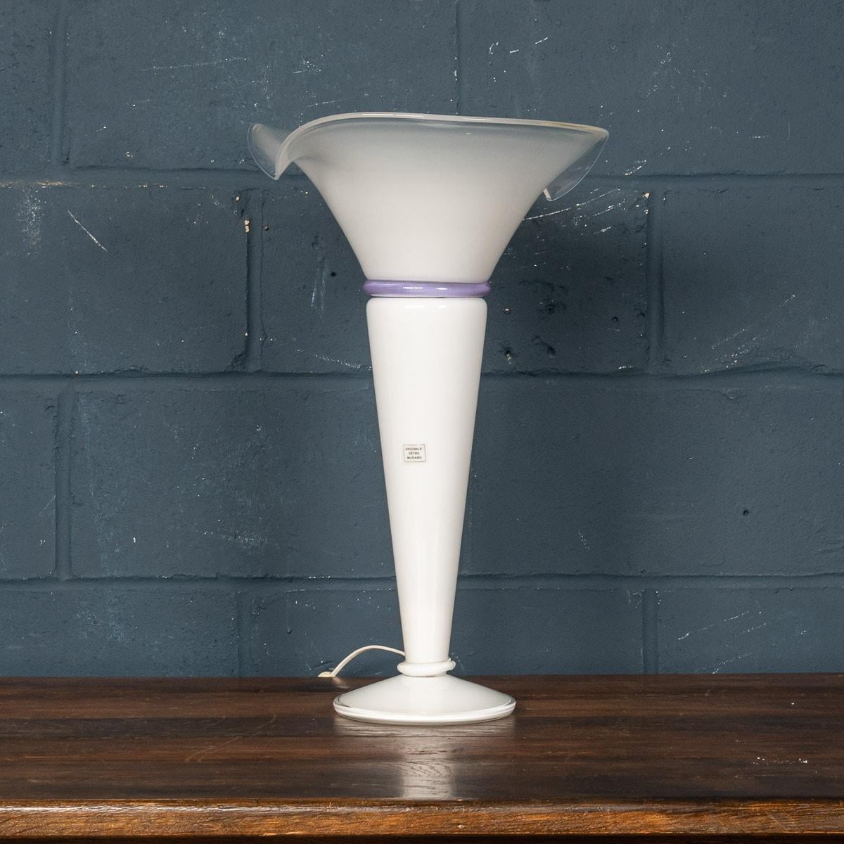 A stunning tulip-form table lamp made in Italy in the latter part of the 20th century. This lamp would have been hand blown by the famous glass makers on the island of Murano in Venice, Italy. It demonstrates the exceptional skill and craftsmanship