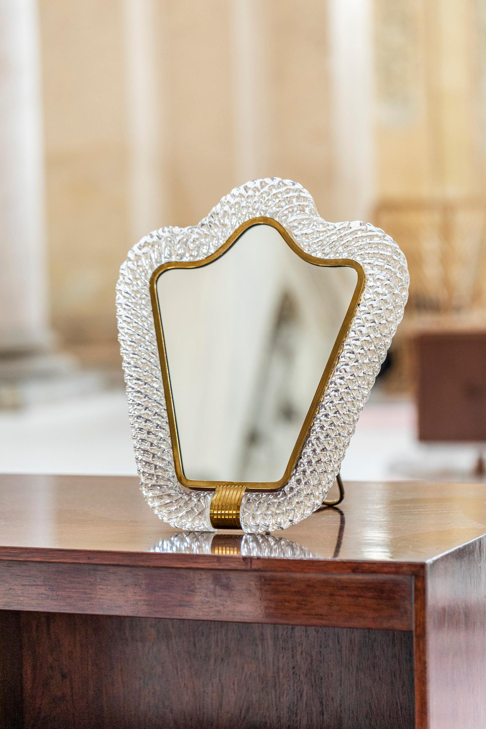 Barovier & Toso table mirror with frame in Murano Glass Torchon.
Mirror with a gorgeous frame entirely in Murano Glass, worked in the way of 
