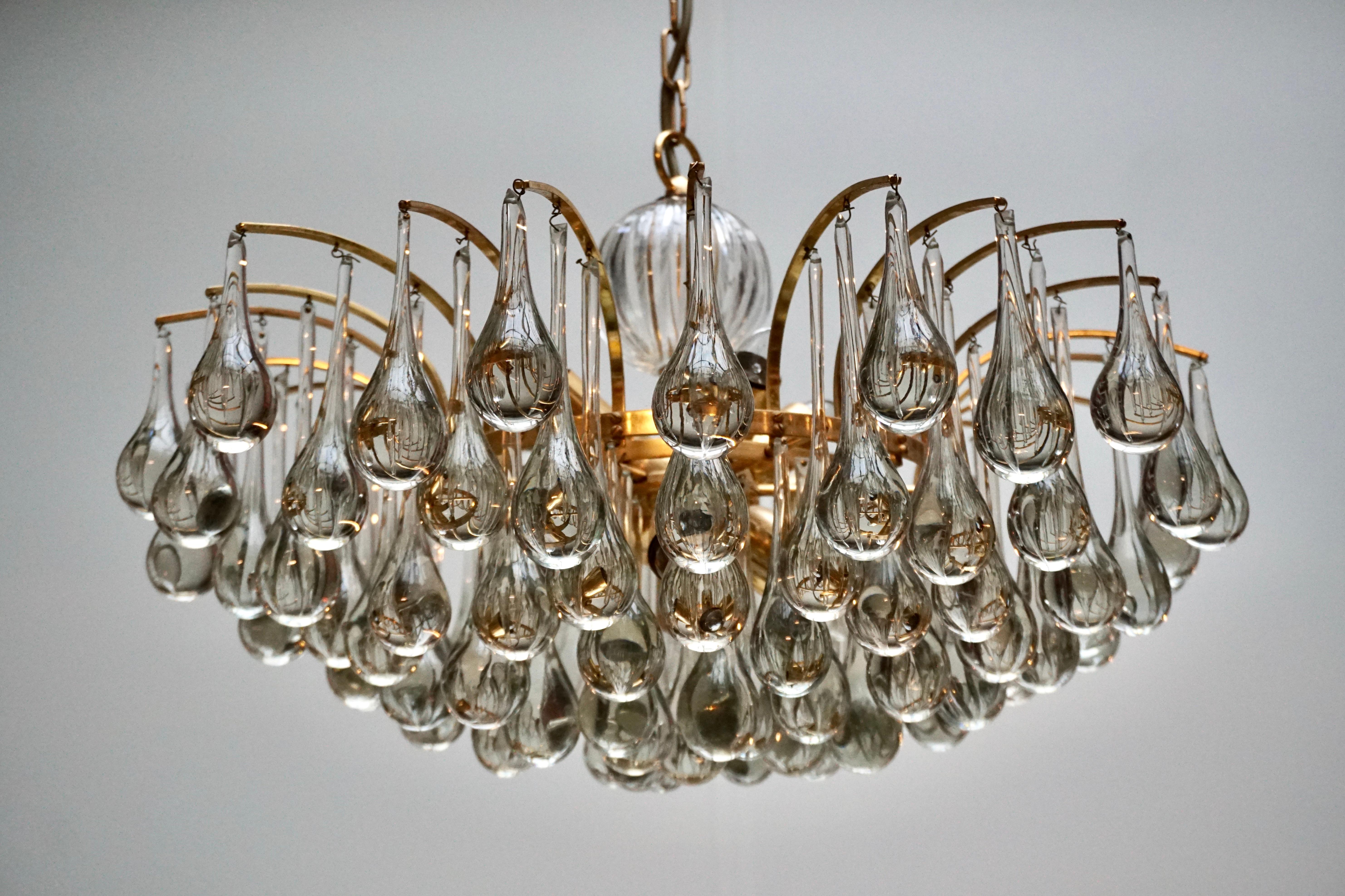 A stunning chandelier, made by Palwa, Germany, circa 1970-1979. It’s composed of Murano teardrop Crystal glass pieces on a gilded brass frame. Best of the 1970s from Germany. 

The light requires ten single E27 screw fit lightbulbs (40Watt max.)