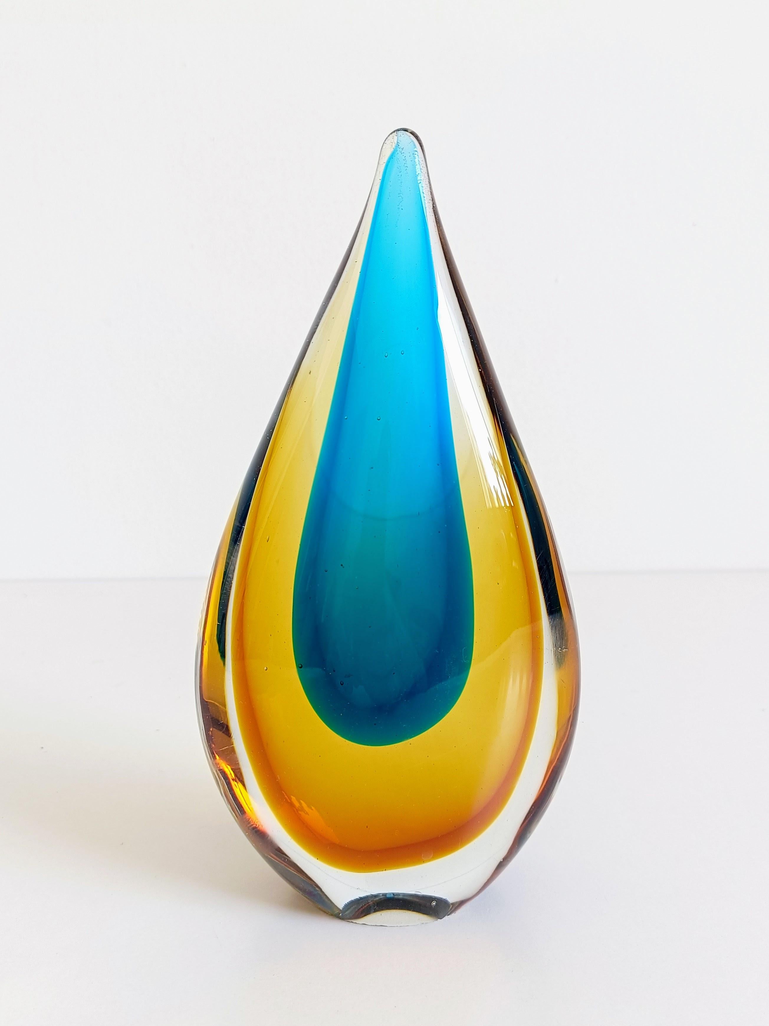 Murano Sommerso Teardrop Glass Sculpture, Attributed to Flavio Poli for Seguso Vetri d’Arte

A striking Murano glass teardrop sculpture in the classic sommmerso technique, featuring a vivid cobalt blue core encased in a vibrant yellow layer, all